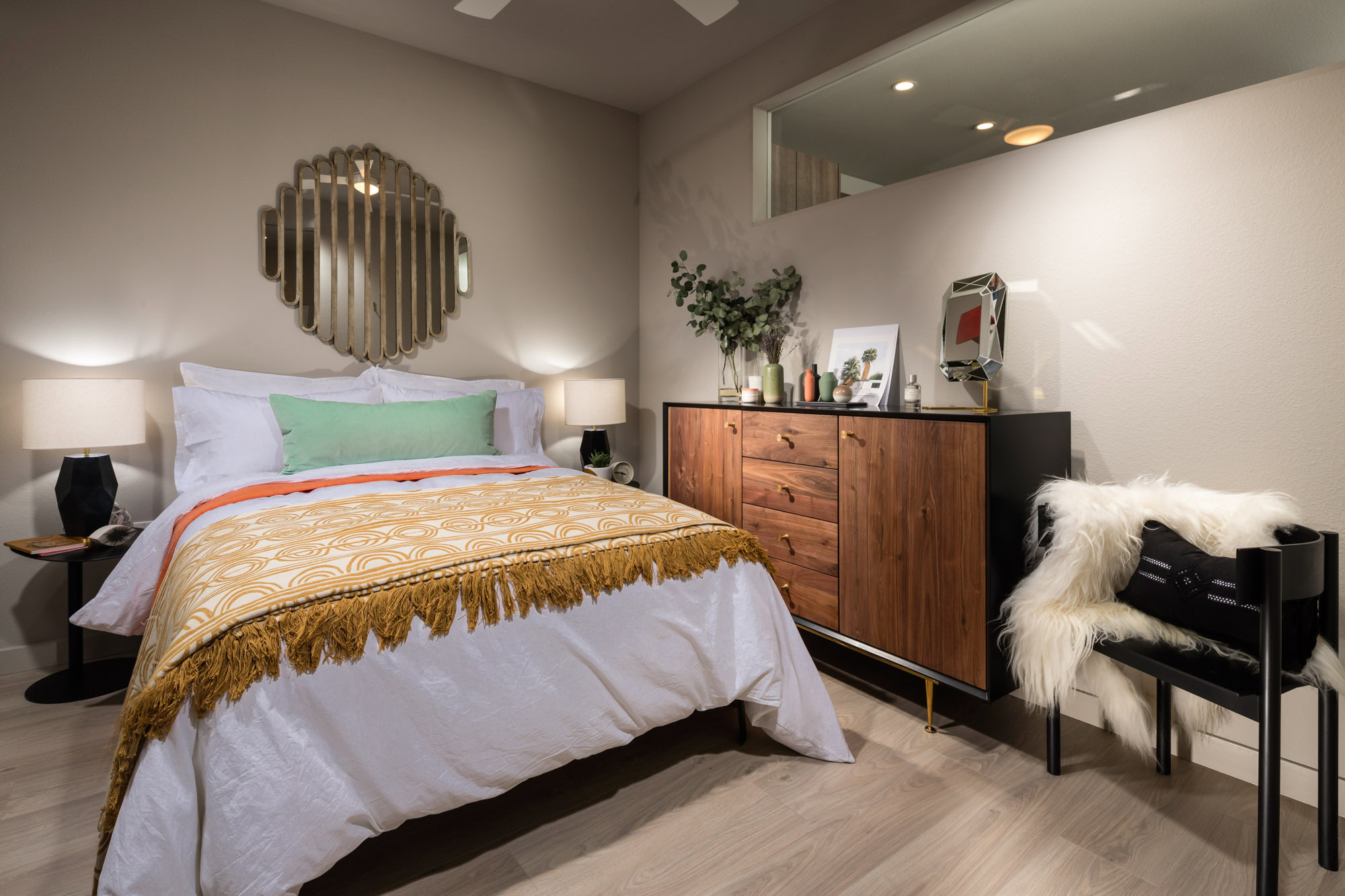 A modern bedroom with a partition wall at 8th and Grand apartments in Downtown LA