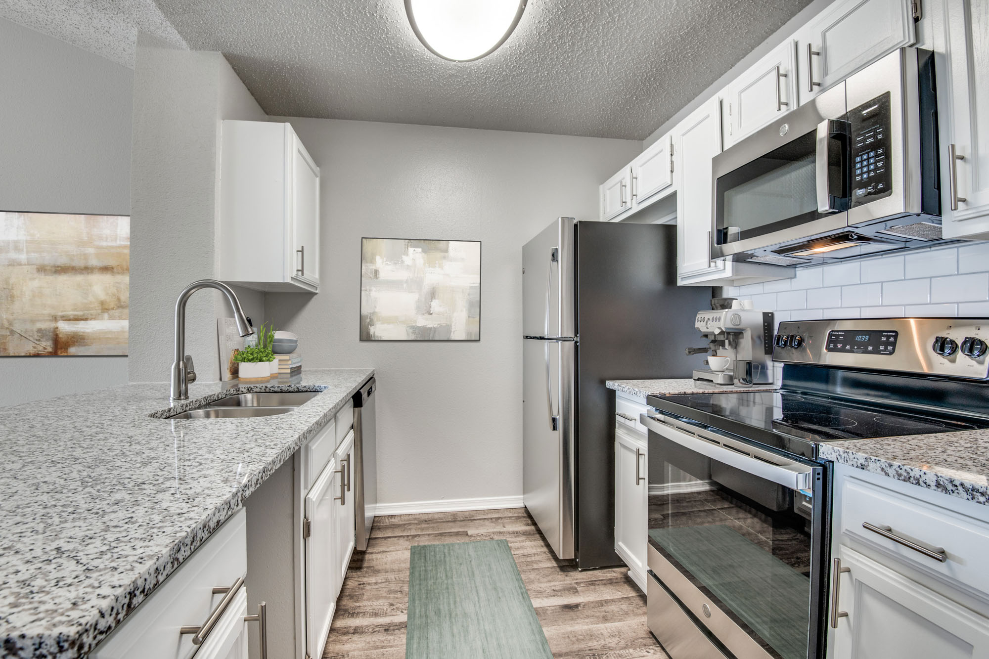 The kitchen in an apartment at The Arbors of Las Colinas in Irving, Texas.