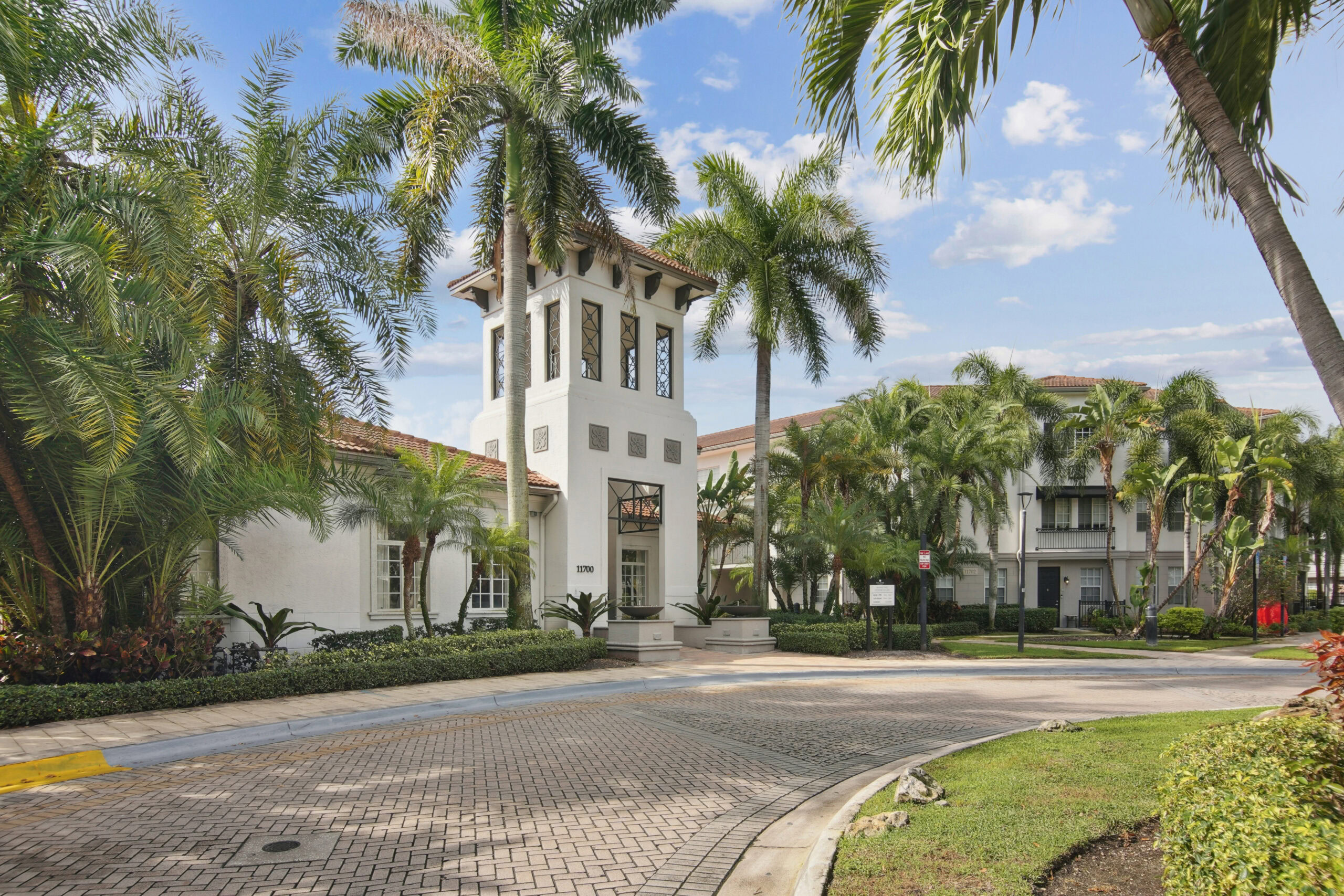 A driveway to the leasing office of the Miramar Lake apartments for rent in Fort Lauderdale, FL