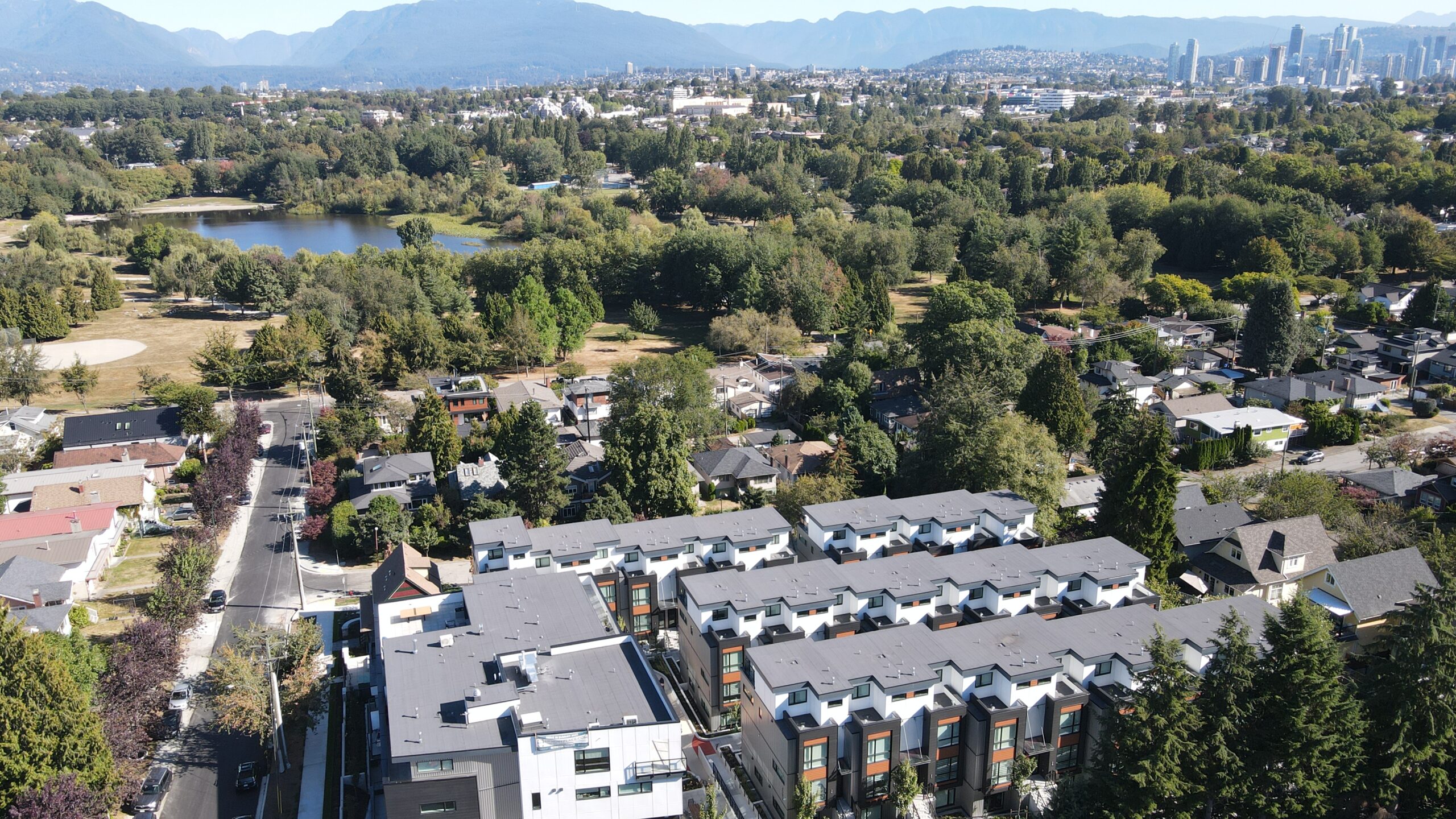 An aerial image of the apartment rooftops of the Hendry Place trout lake apartments