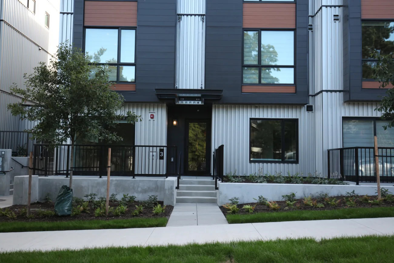 A path and stairs to the entrance of apartment units at the Hendry Place luxury apartments in Vancouver