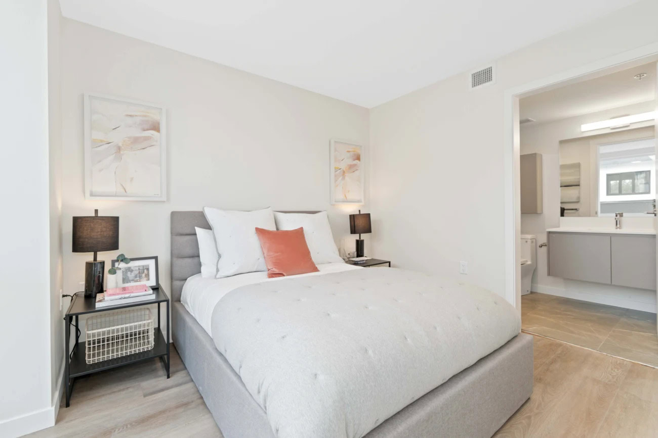 An ensuite bedroom with a spa-like bathroom at the Hendry Place luxury apartments in Vancouver