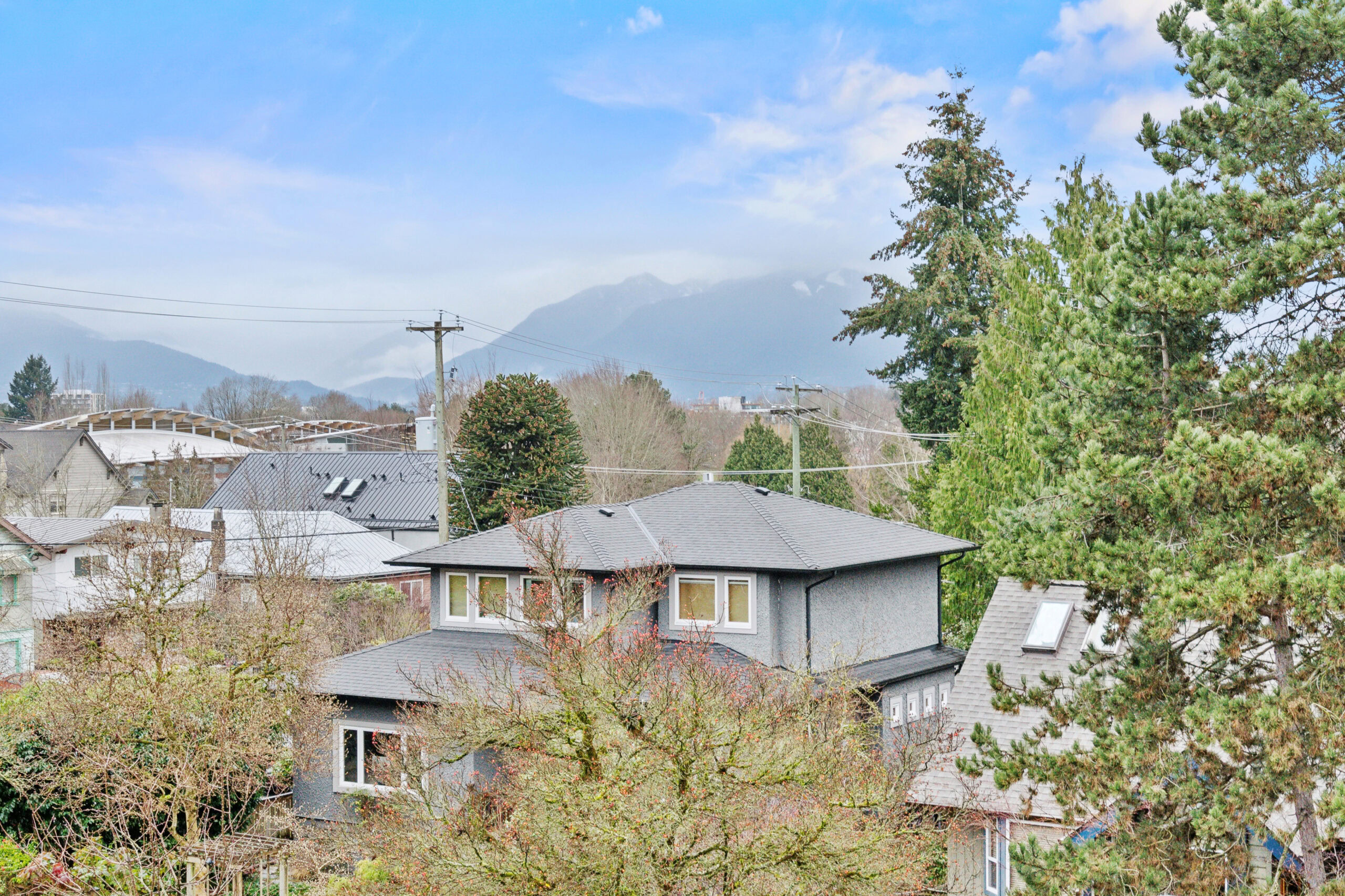 The exterior of a luxury apartment with the Vancouver Mountain views behind the apartments in vancouver canada