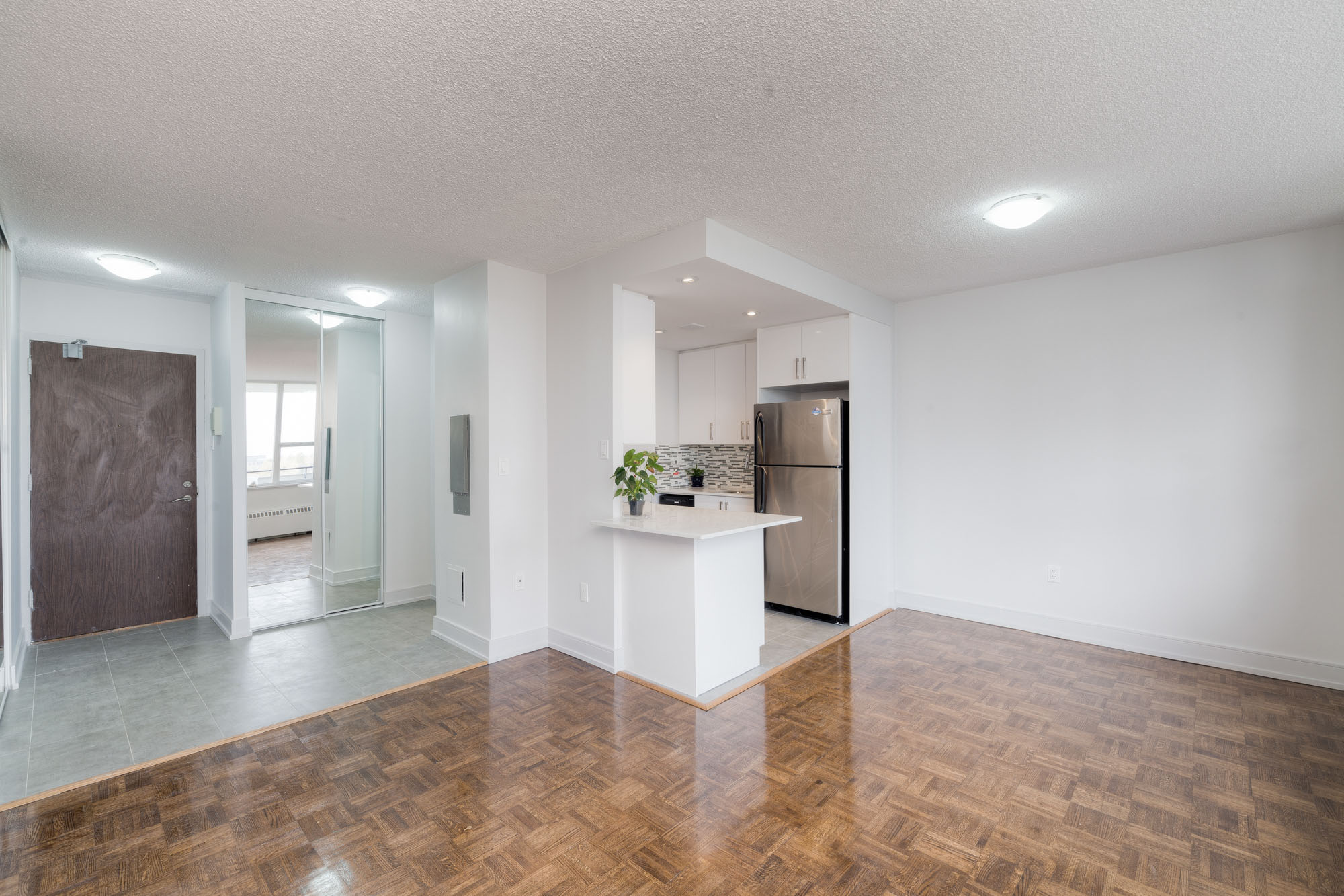 The living area at an apartment at 77 Davisville Avenue in Toronto, CA.