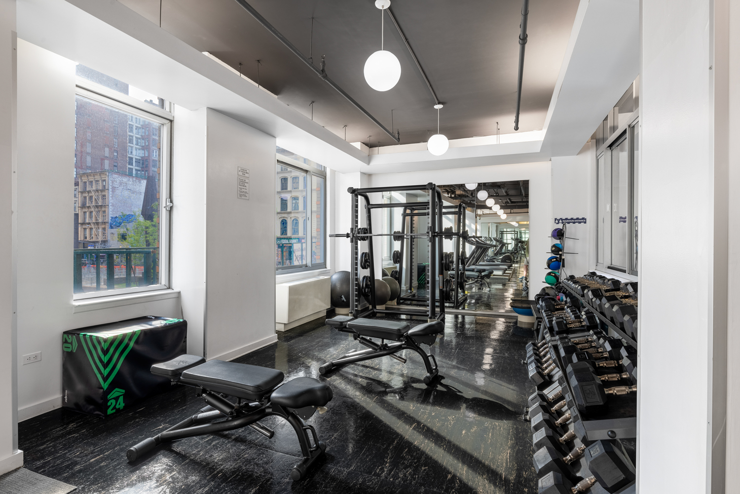 Sun-filled, fully equipped Fitness Center with walls of windows.