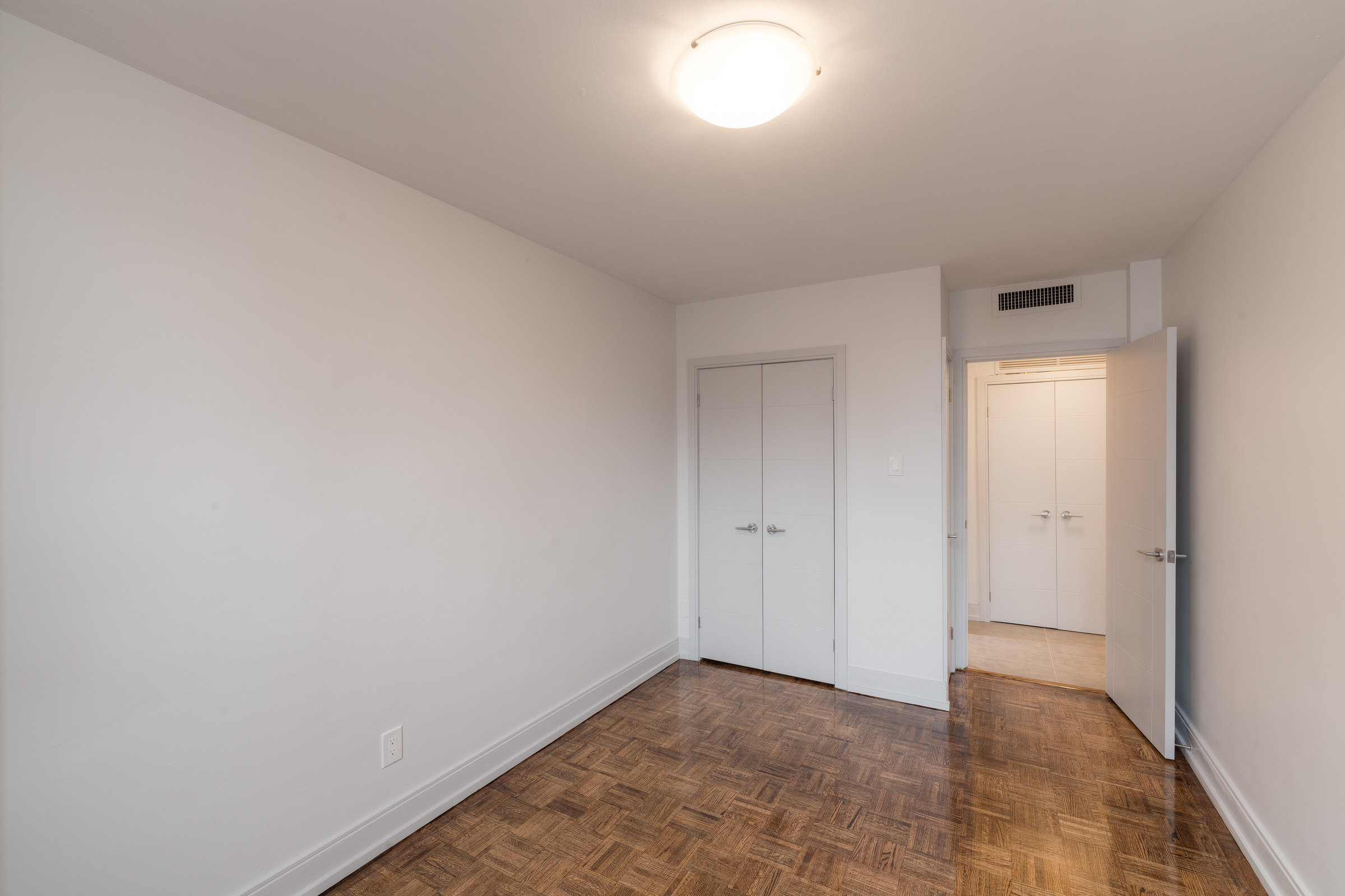 The bedroom of an apartment at Village Green in downtown Canada.