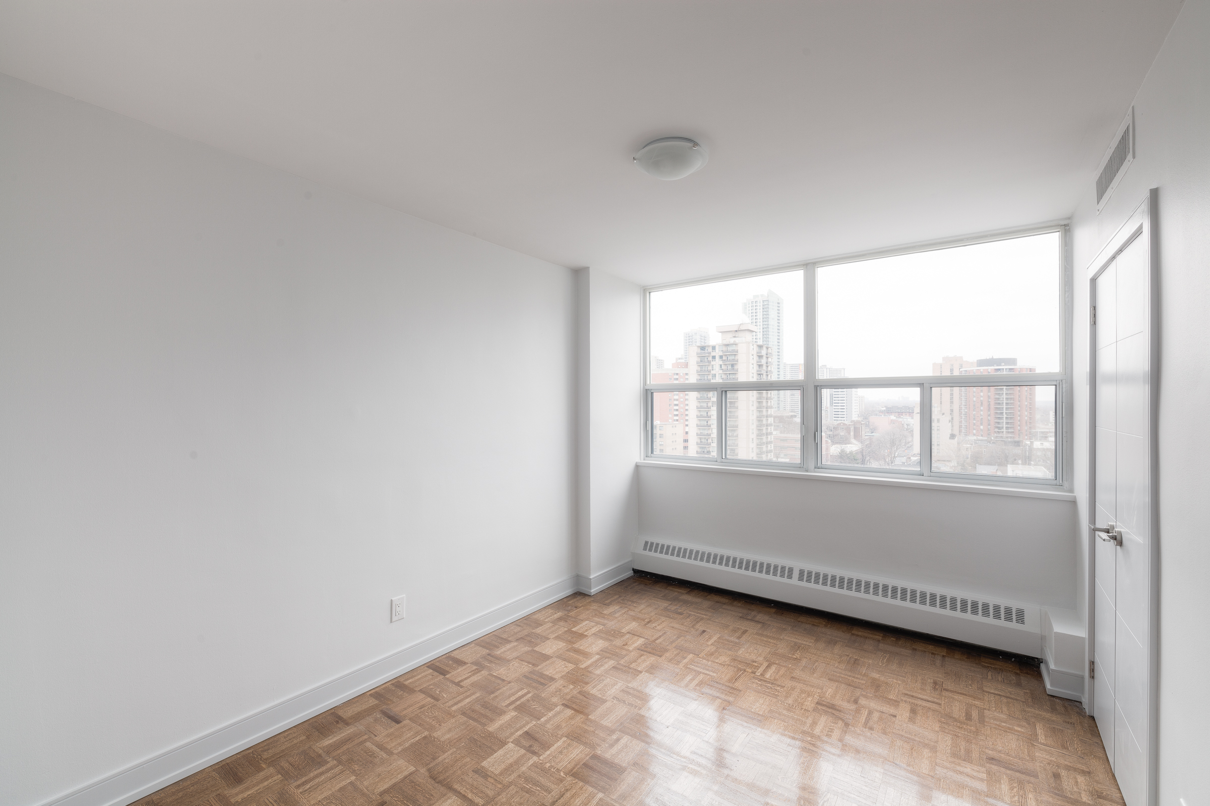 The bedroom of an apartment at Village Green in Toronto, Canada.