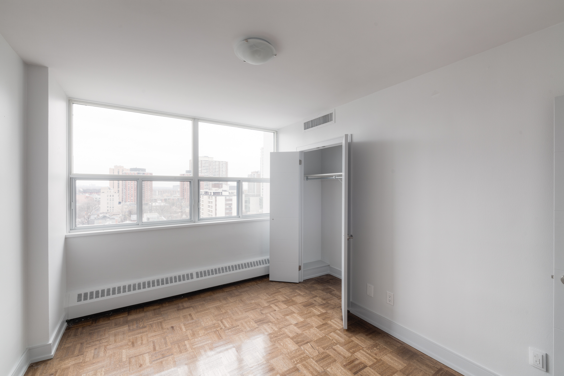 The bedroom of an apartment at Village Green in the heart of Church-Wellesley Village.