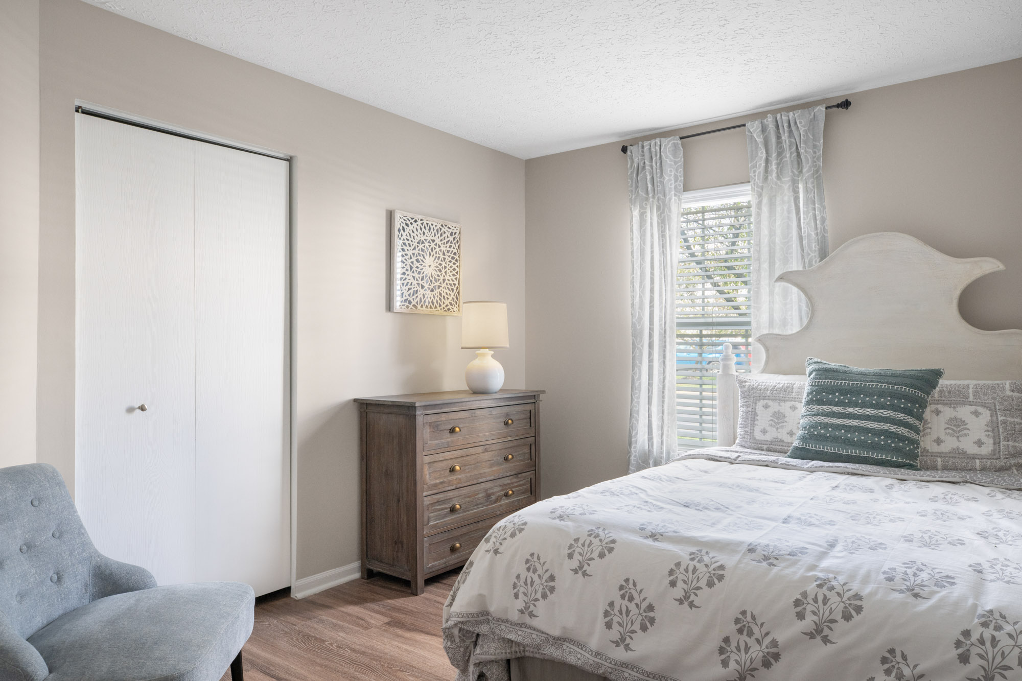 The bedroom in an apartment at The Gardens in Columbus, OH.