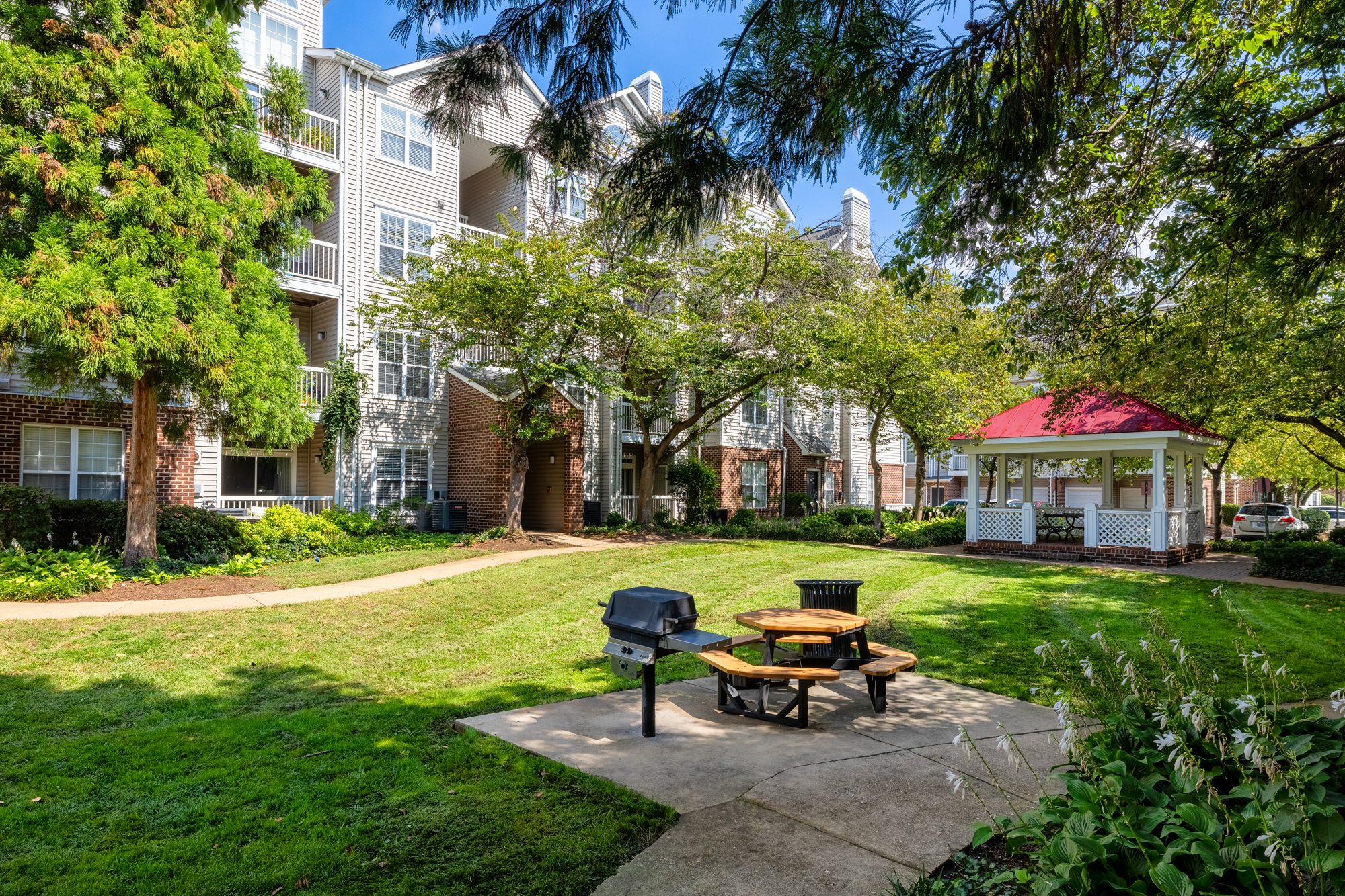 Courtyard with grilling area and gazebo.