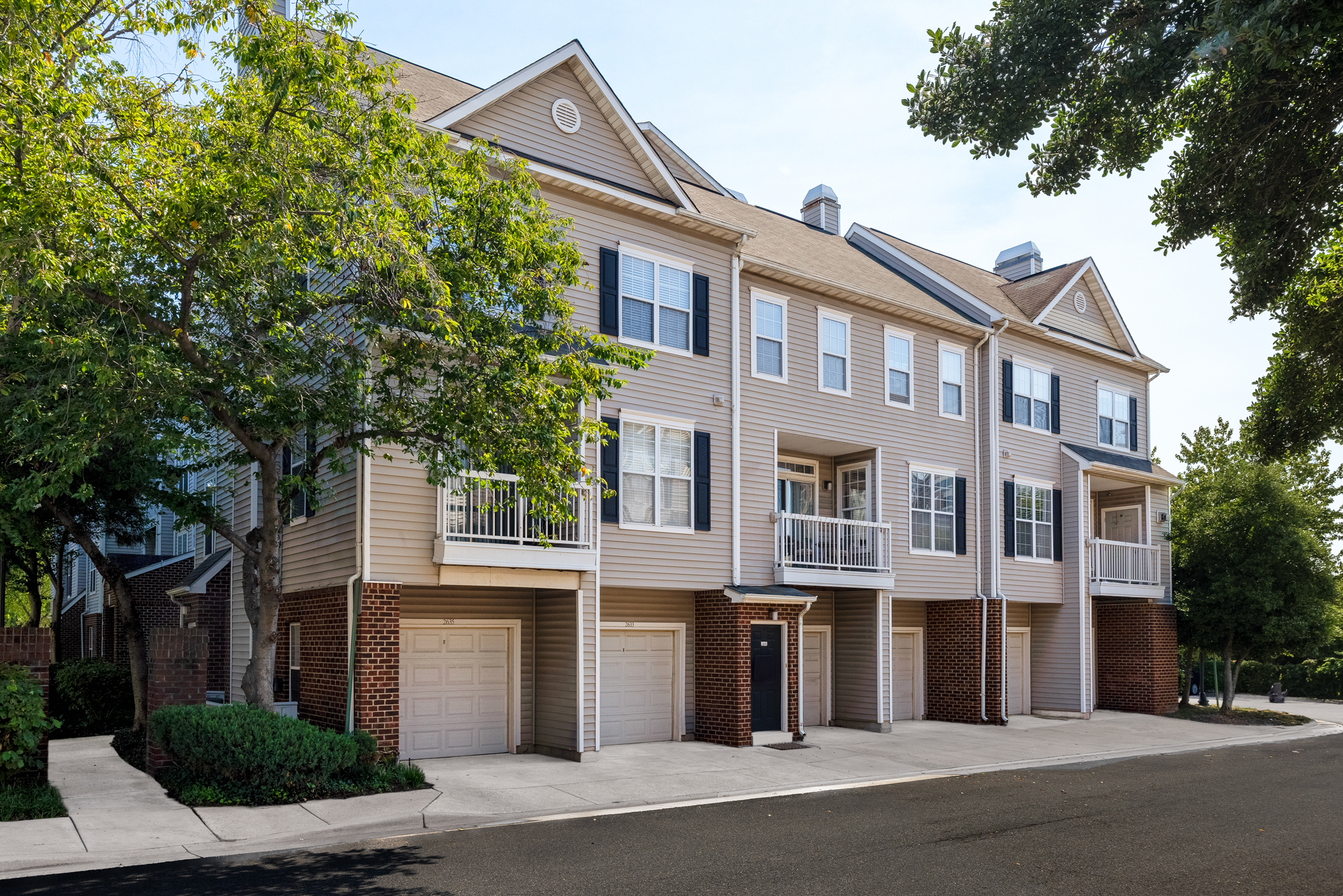 Exterior of Cameron Court with attached garages available.