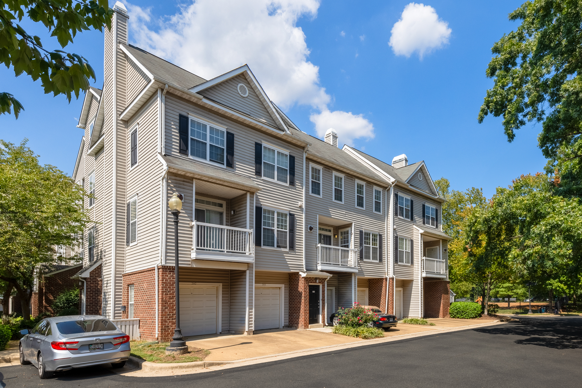 Exterior of Cameron Court with attached garages available.