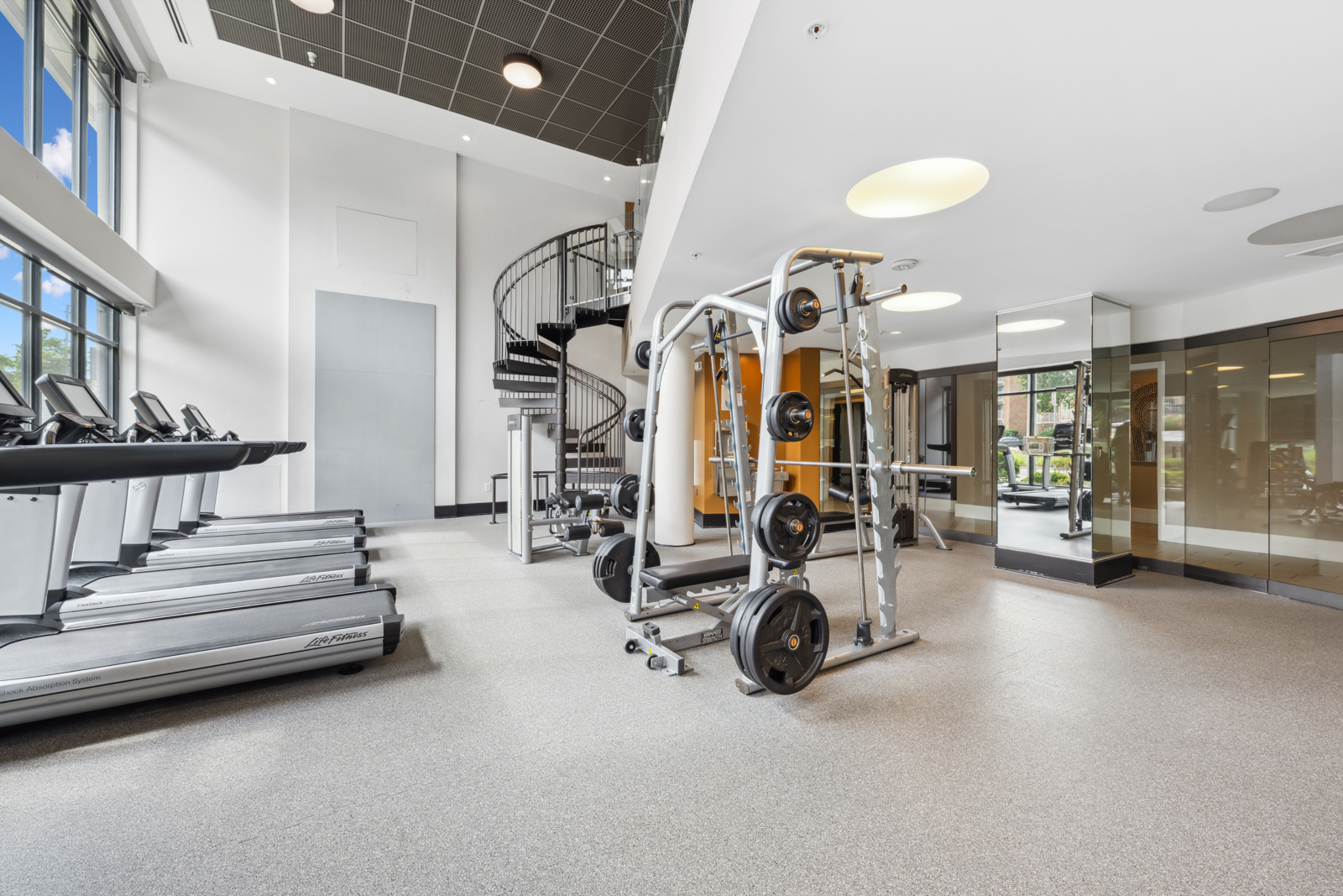 Expansive fitness center encompassing two stories.