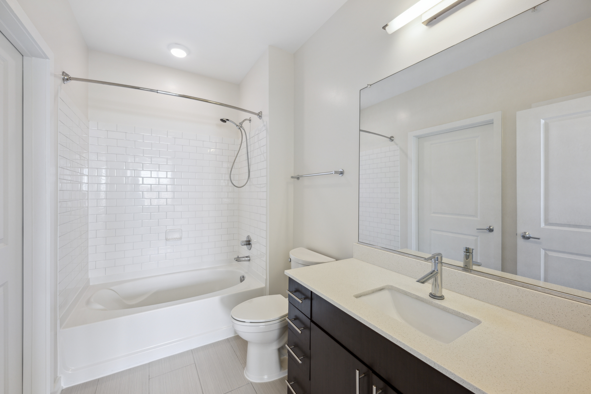 Ceramic tile baths and quartz countertops.