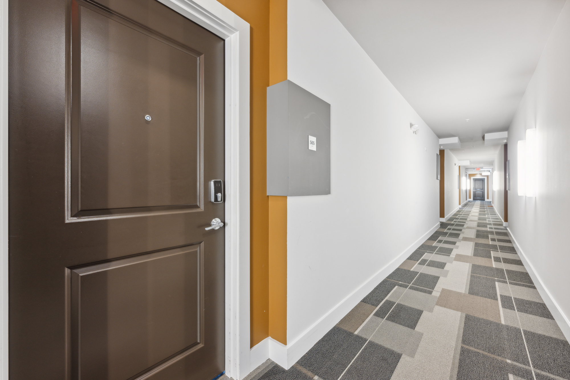 The interior corridor of The Parker at Huntington Metro with an apartment entry.