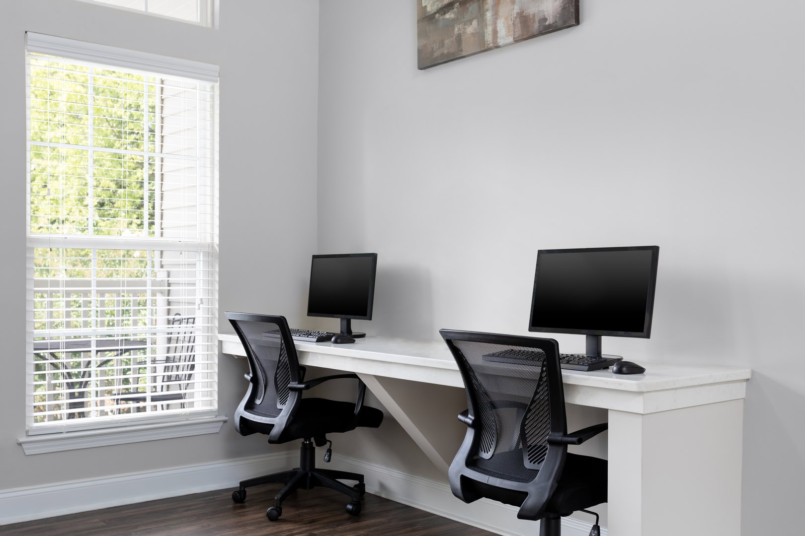 A computer station with two desktops at the Ashford Place apartments in South Charlotte