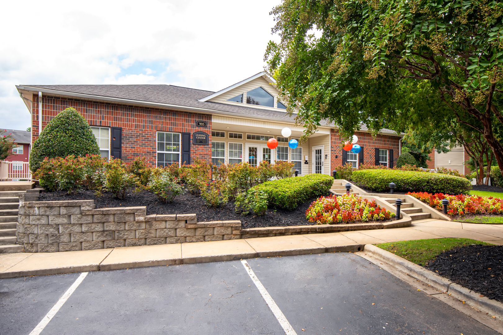 A parking lot in front of the leasing office of the Ashford Place apartments in South Charlotte