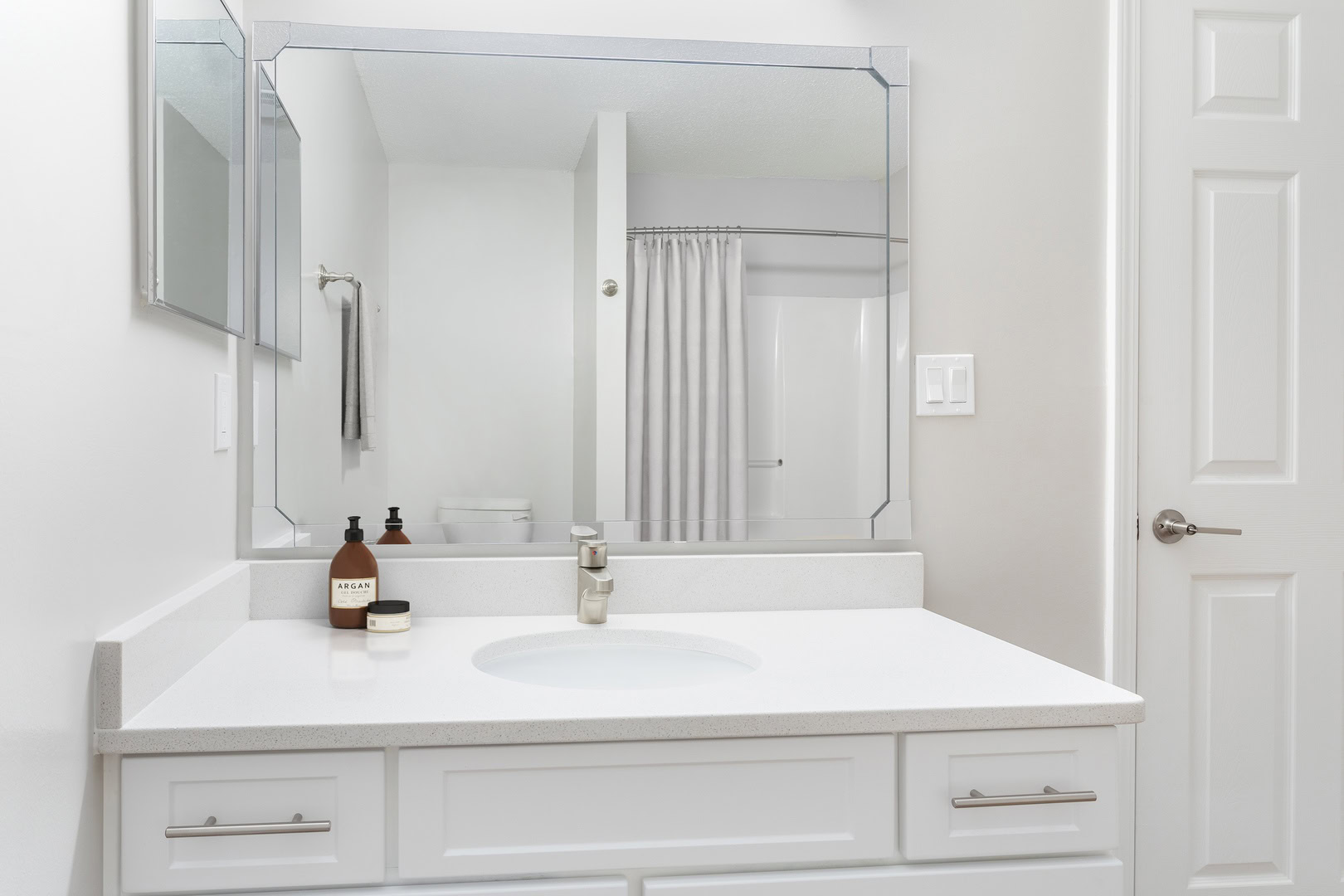 A bathroom with a large vanity in an apartment at the Ashford Place apartments in South Charlotte