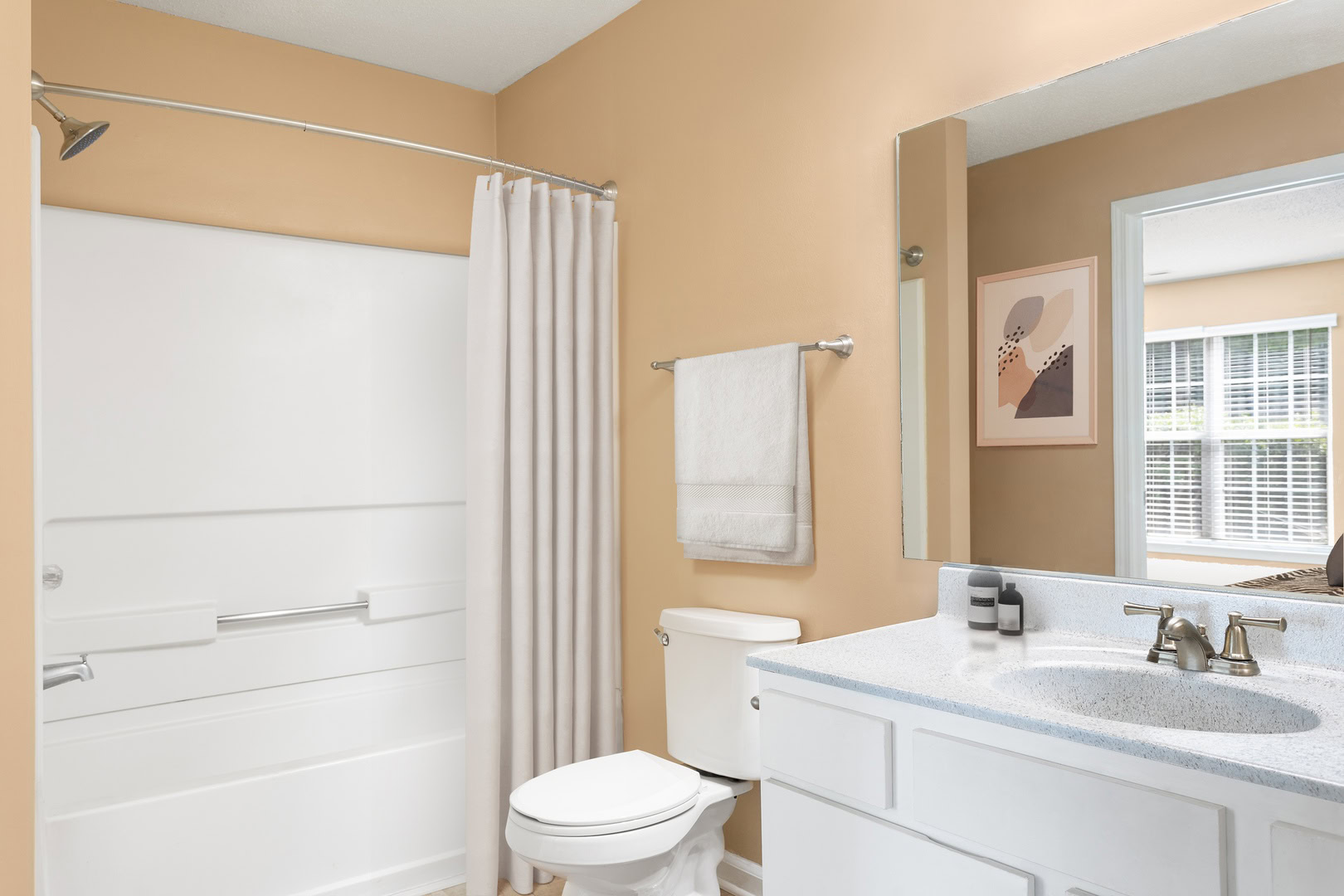 A bathroom with a large vanity in an apartment at the Ashford Place apartments in South Charlotte