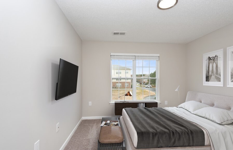 A bedroom in an apartment at the Ashford Place apartments in South Charlotte