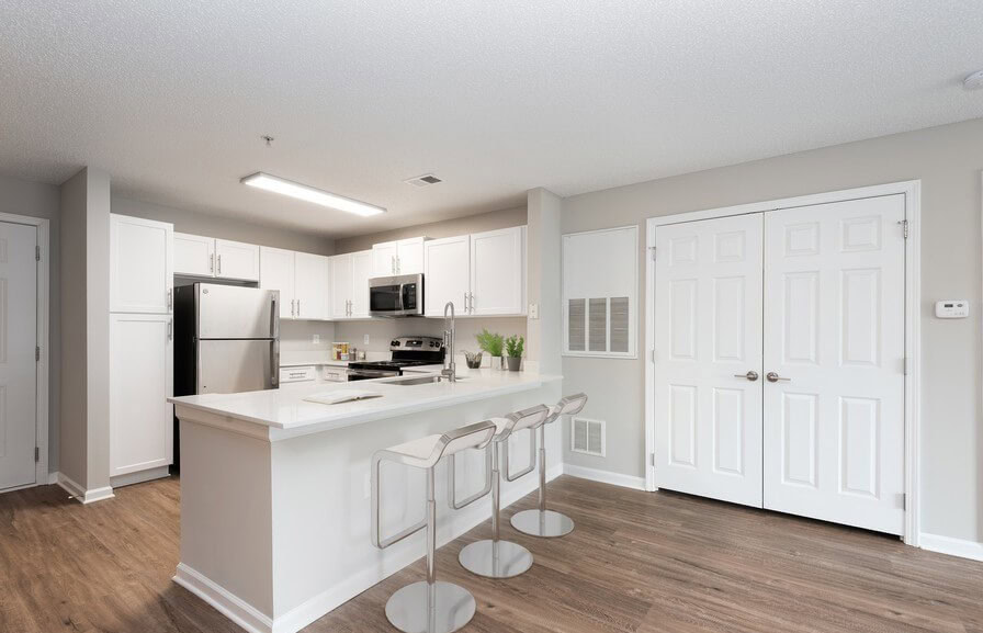 A dining area at the peninsula of the kitchen at the Ashford Place apartments in South Charlotte