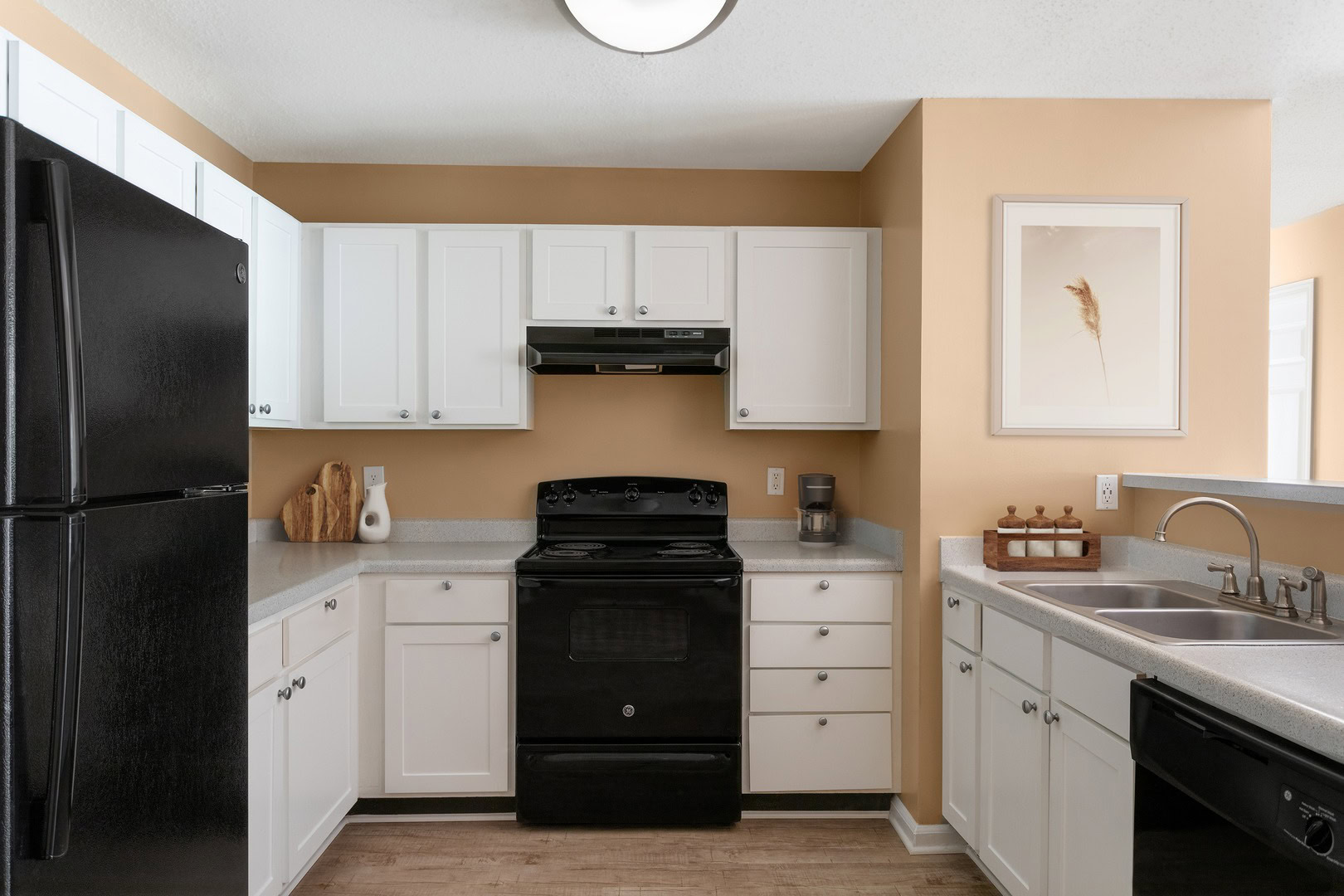 A kitchen with black kitchen appliances at the Ashford Place apartments in South Charlotte