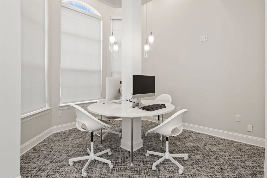A coworking space with a table and desktop at the Courtney Ridge apartments at the south end of Charlotte, NC