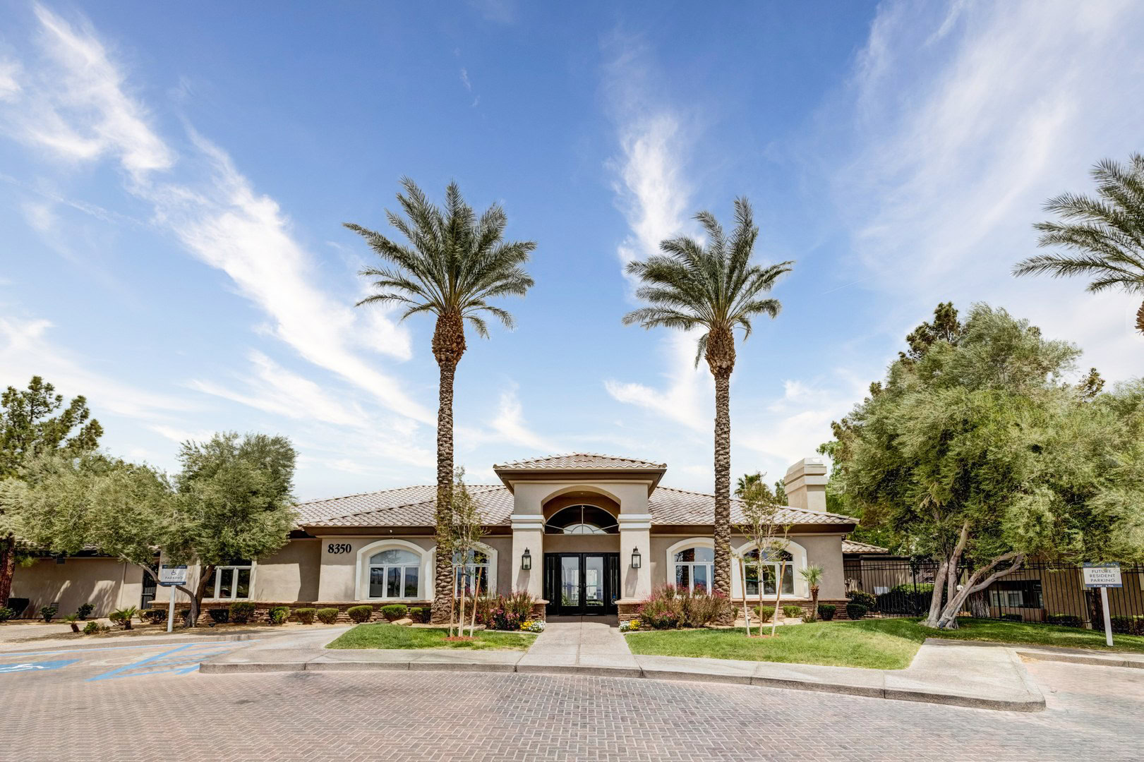 An amenity building with parking space in front of it at the Spring Valley apartments for rent in Las Vegas