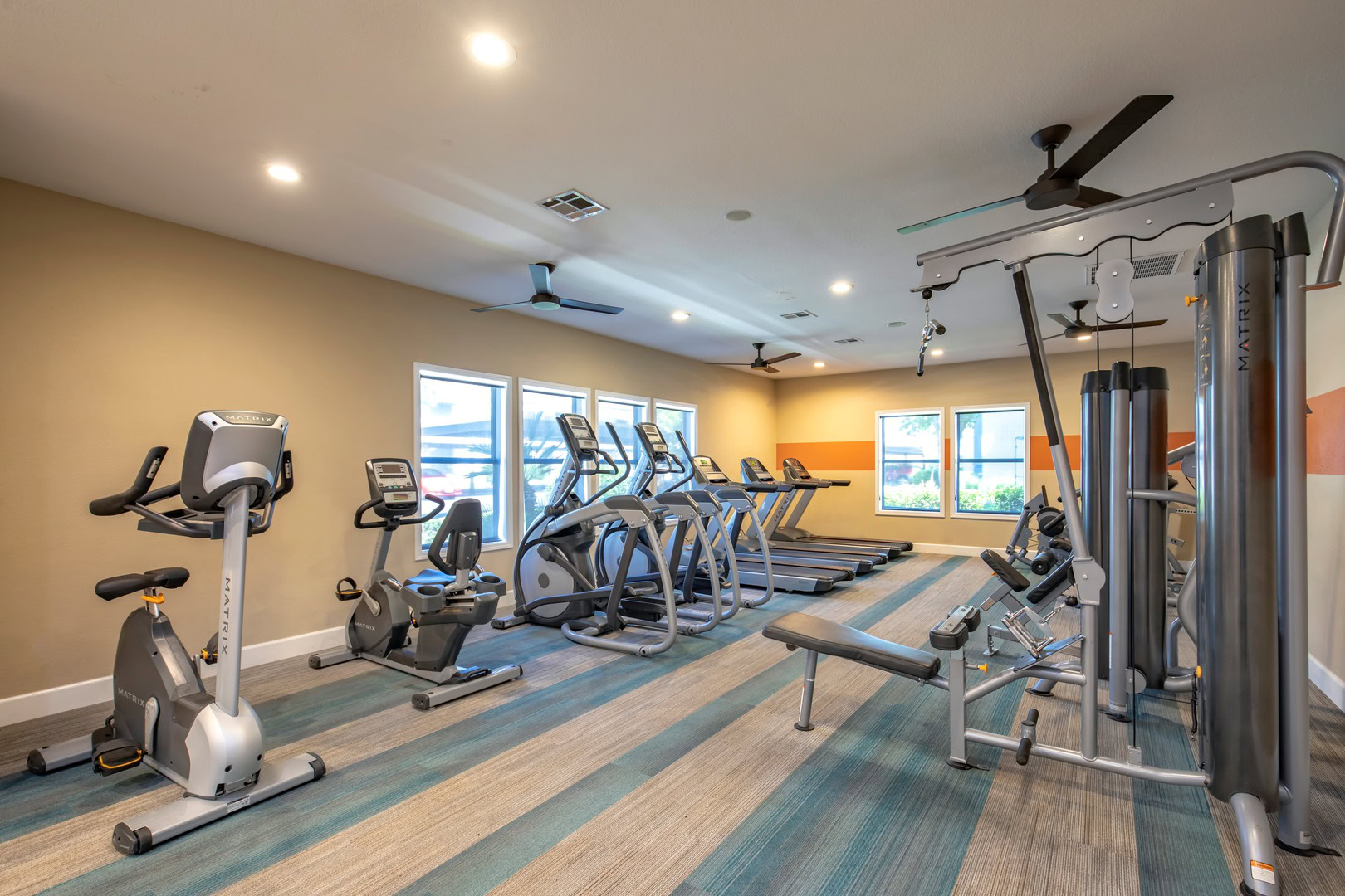 A fitness center with stationary bikes, elipticals and treadmills at Xander 3900 apartments in Northwest Las Vegas