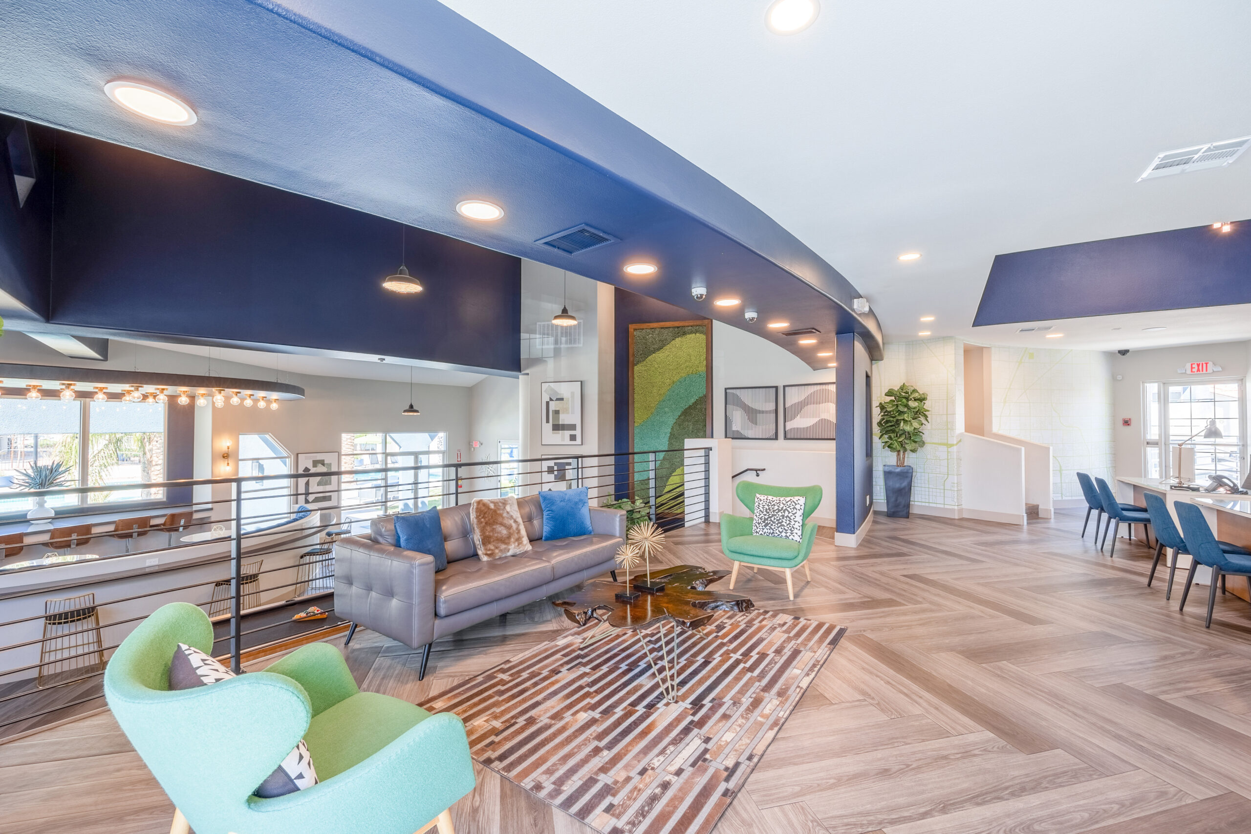 The lobby area lounge and stairs leading to more lounge space with bar seating at The Met Las Vegas apartments for rent