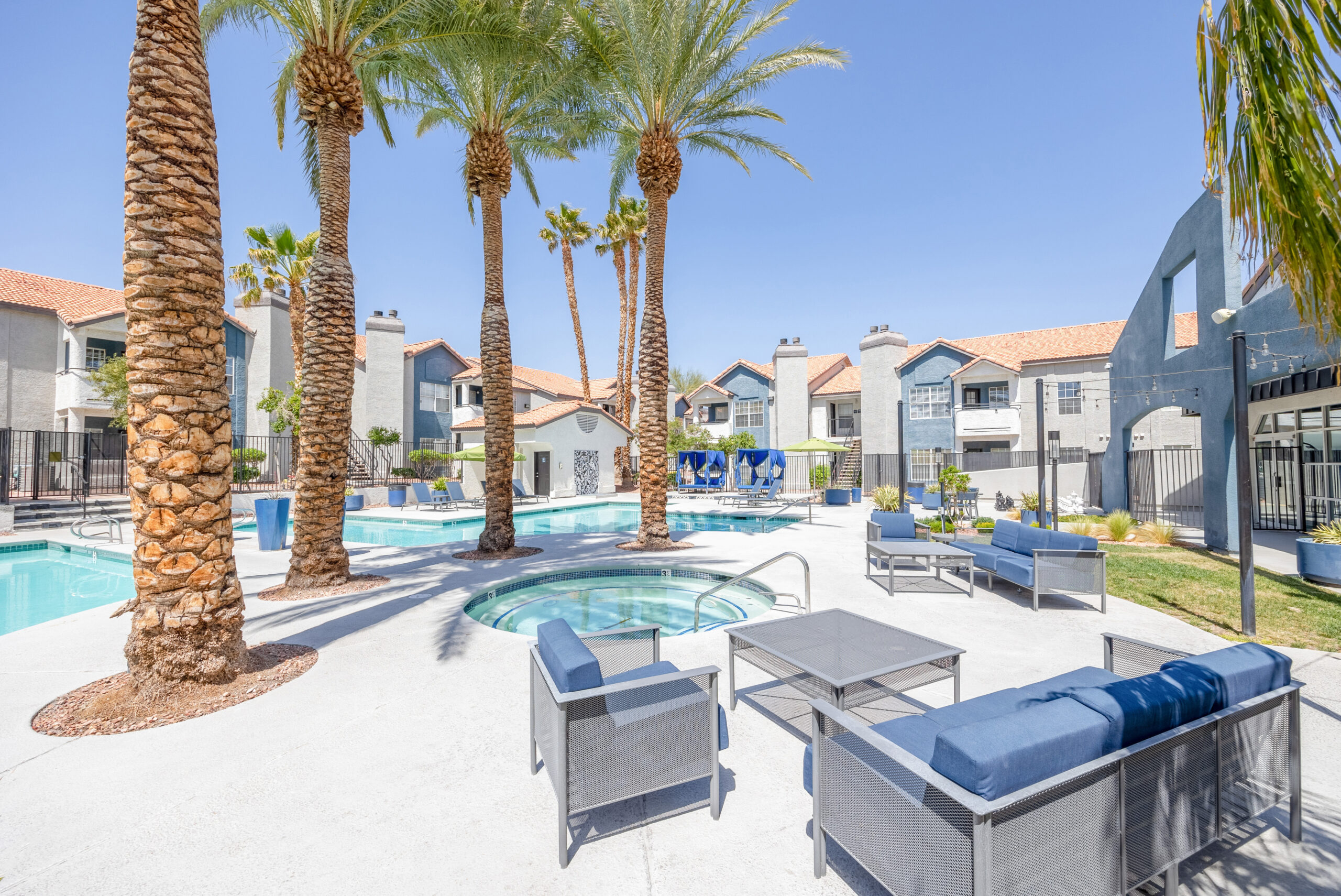 Lounging areas by the pool and jacuzzi at The Met Las Vegas apartments for rent
