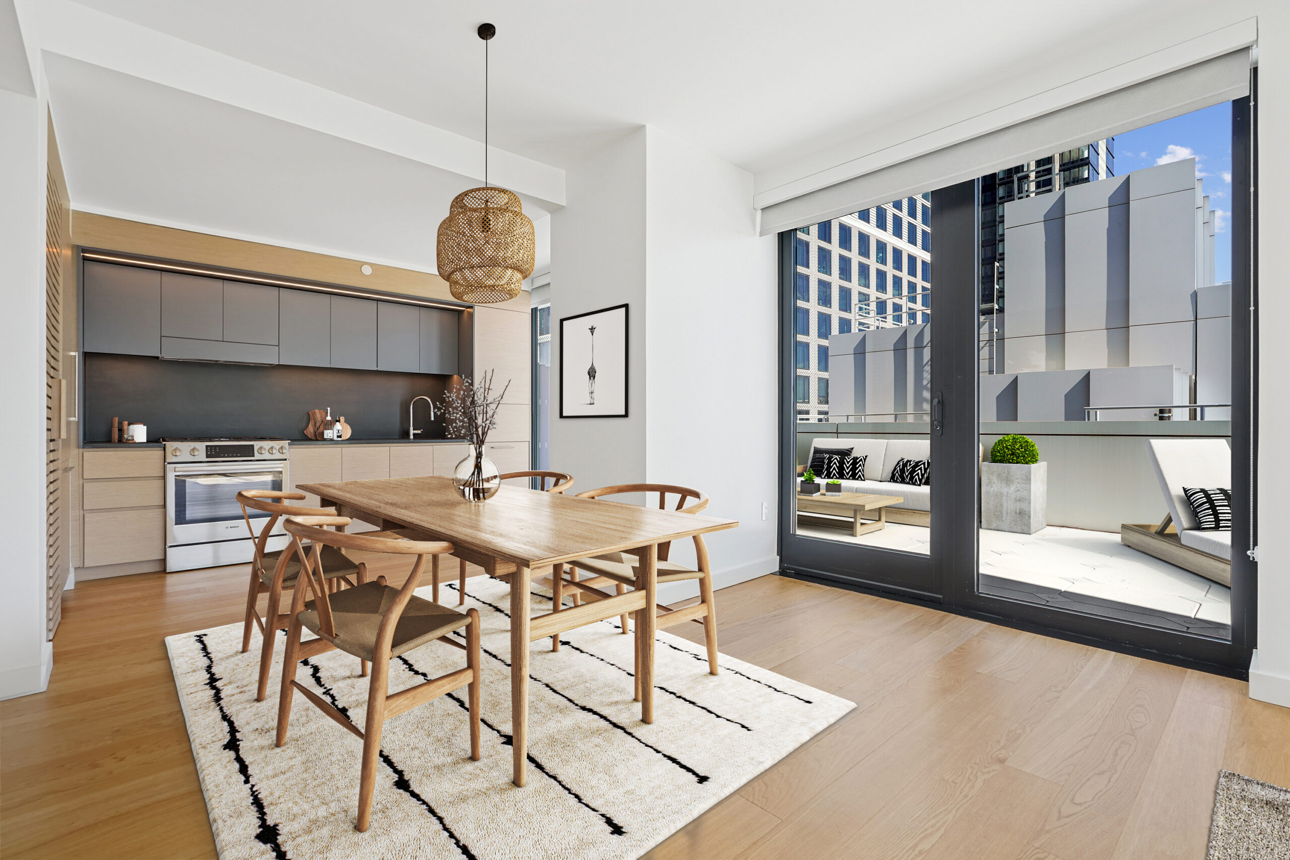 Modern kitchen and dining area with a view of the outdoor terrace