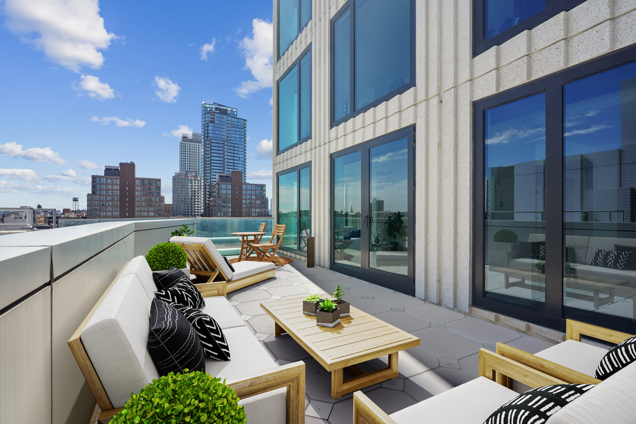 Outdoor terrace with city views and furniture