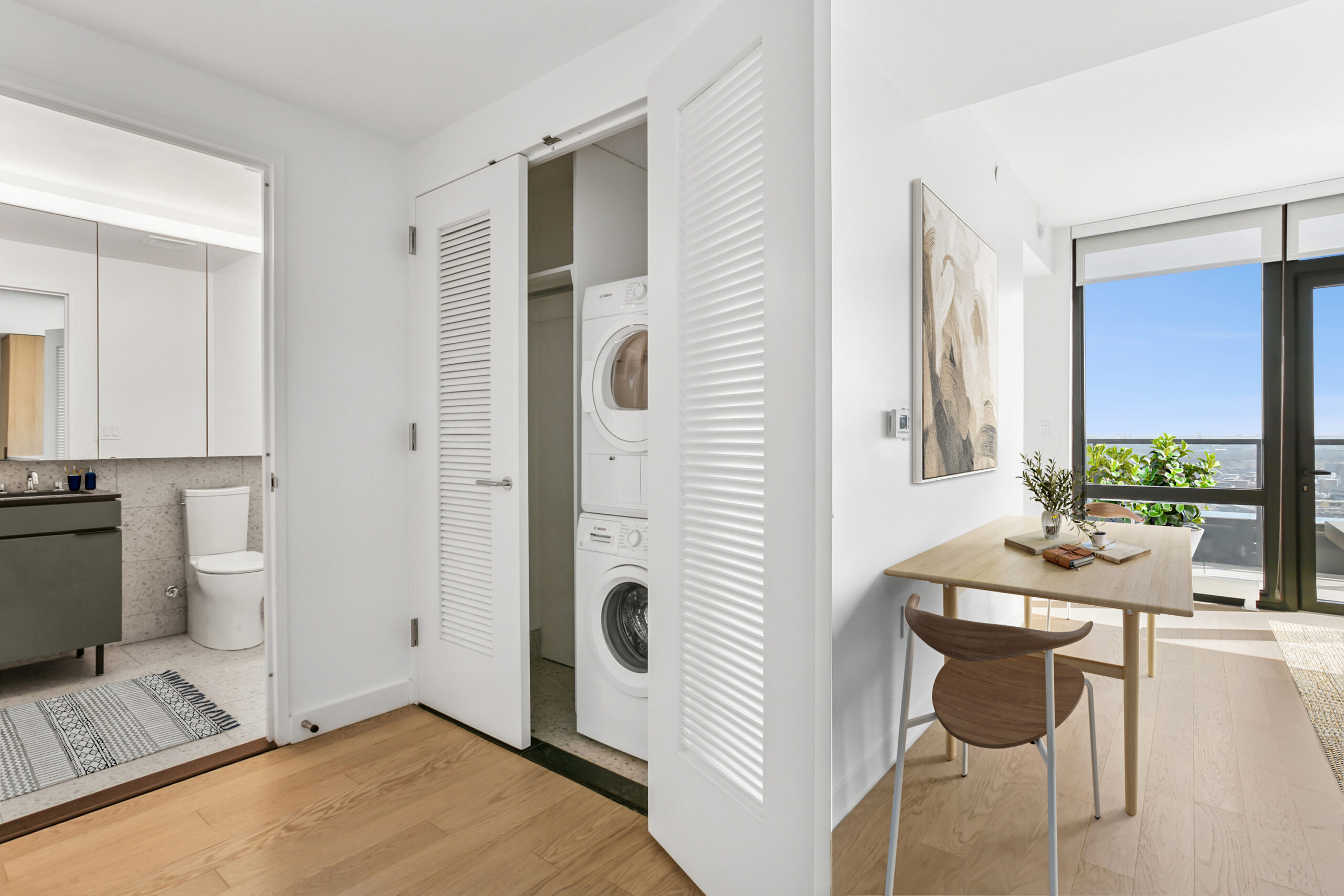Spacious apartment with modern bathroom, in-home washer and dryer, and living area city view