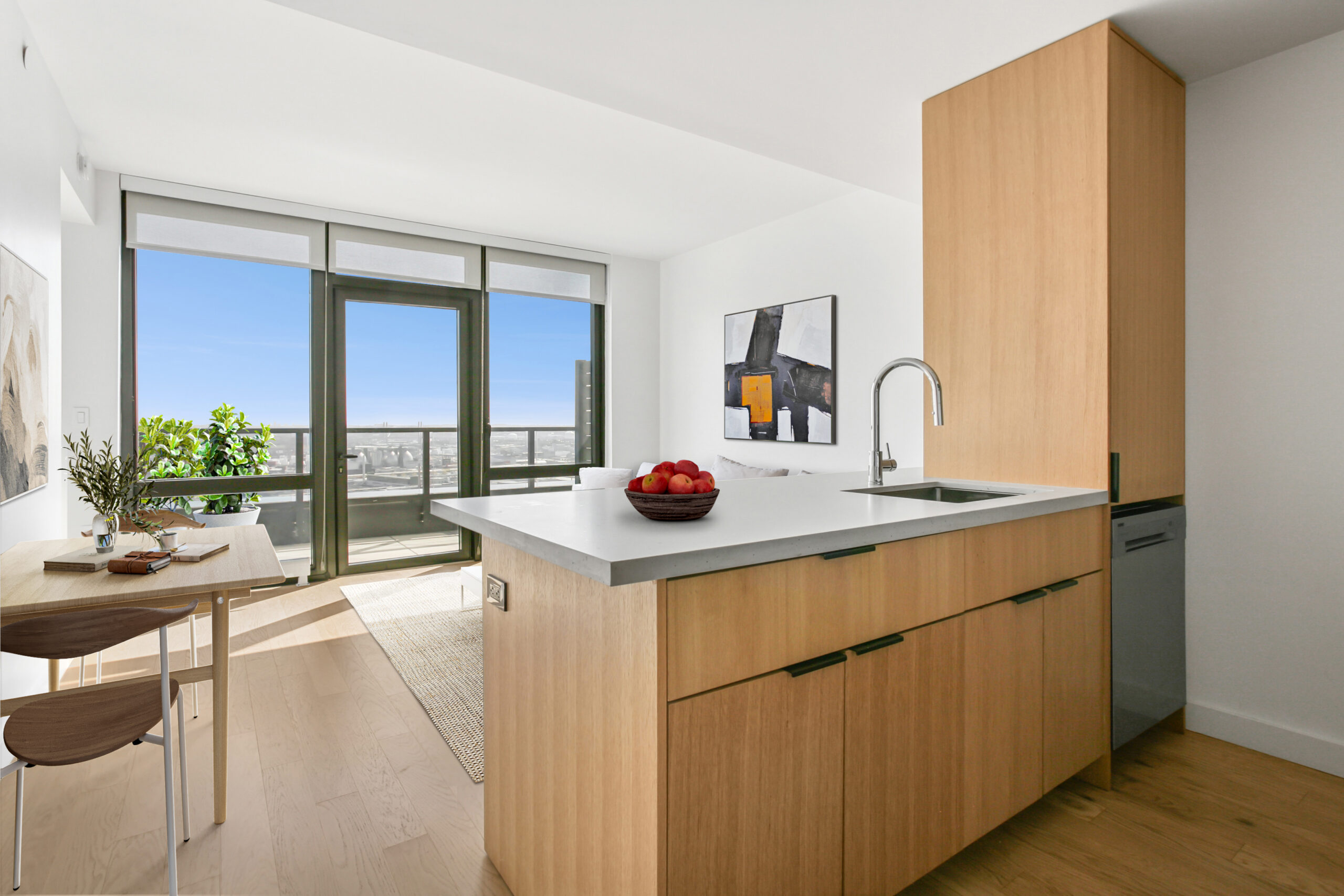 Modern kitchen with wood cabinetry and quartz countertops