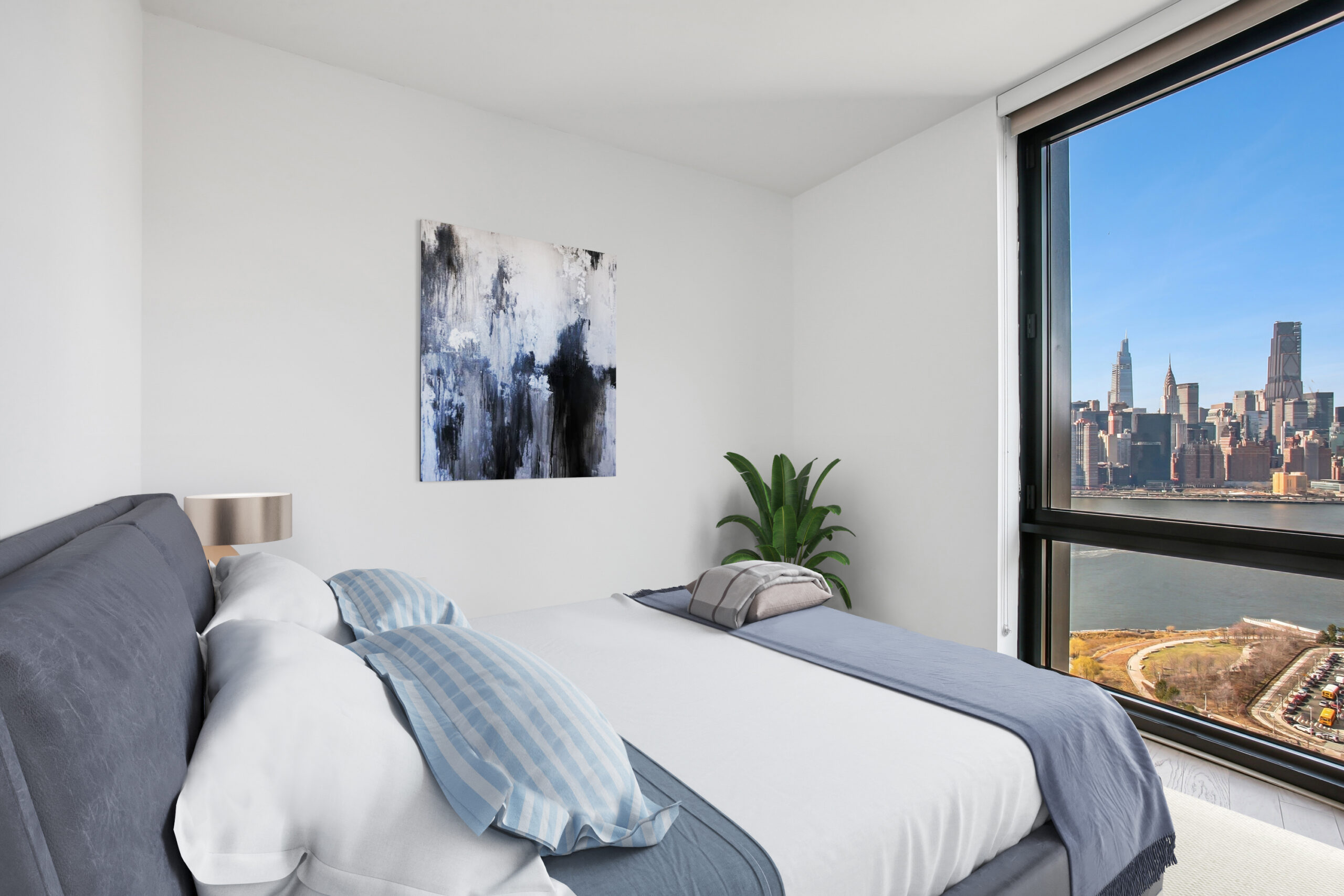 Modern bedroom with sweeping water views