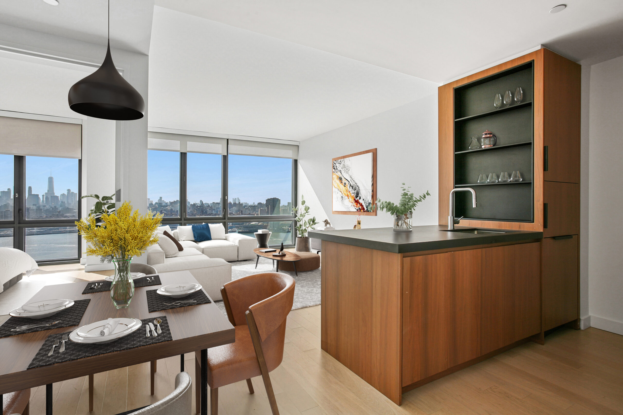 Modern kitchen with wood cabinetry and quartz countertops leading to living area with generous water views