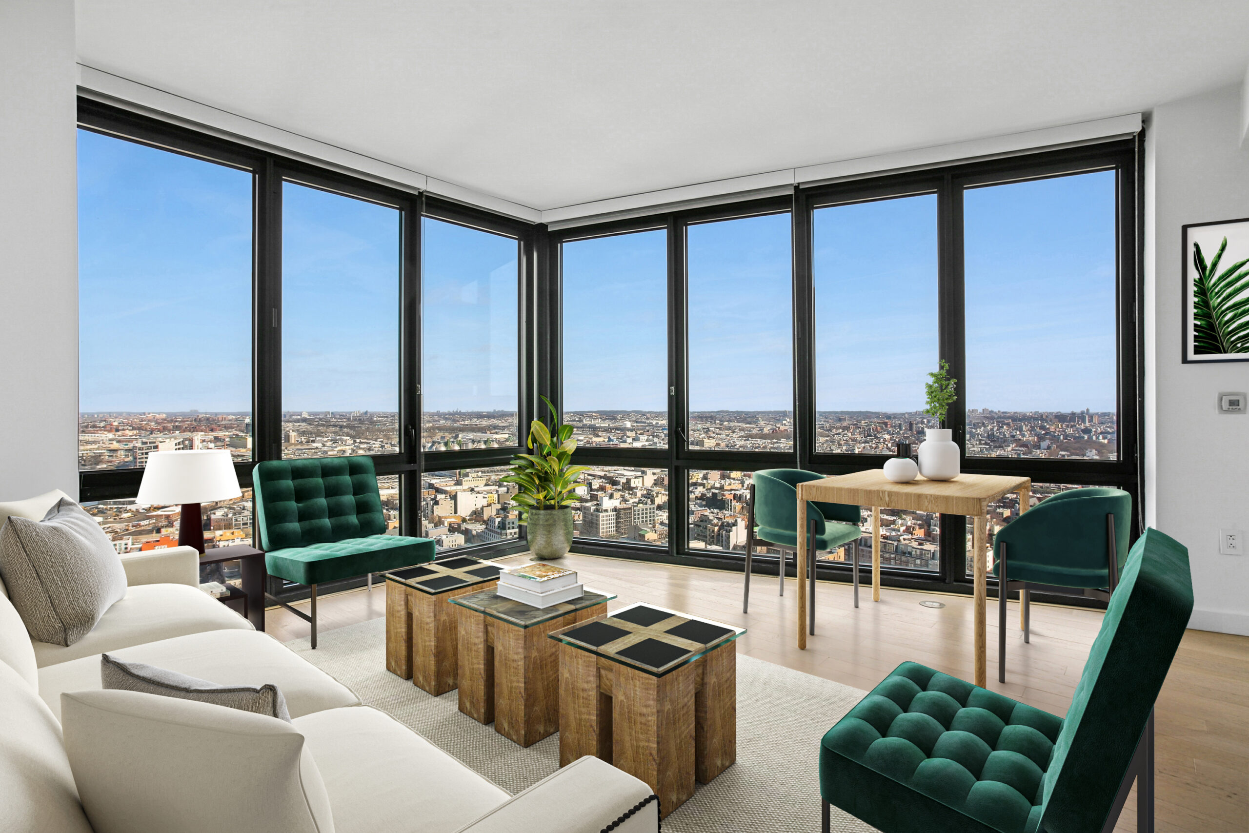 Modern living area with generous floor-to-ceiling windows offering city views