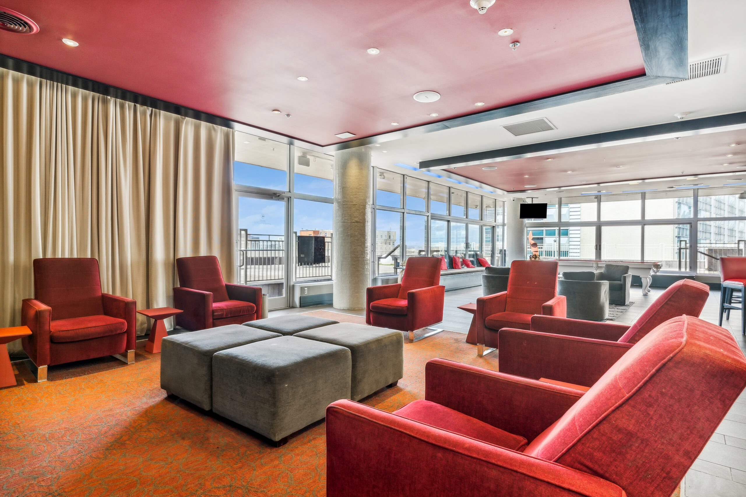 Cozy rooftop theatre in The Continentals rooftop lounge with curtains on the windows for privacy and lighting