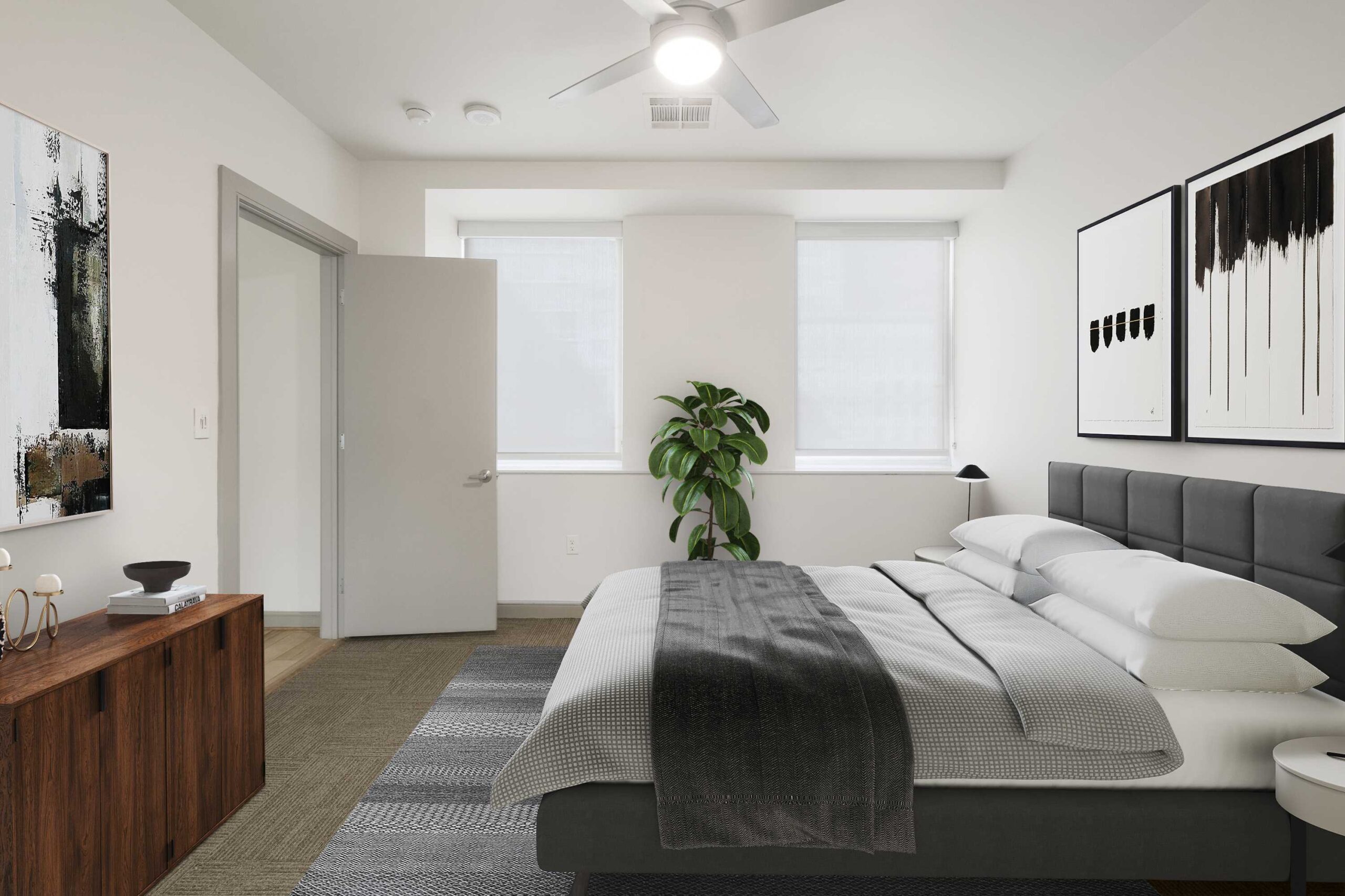 Modern Bedroom at The Continental apartments in Dallas, Texas with modern furniture and natural light.