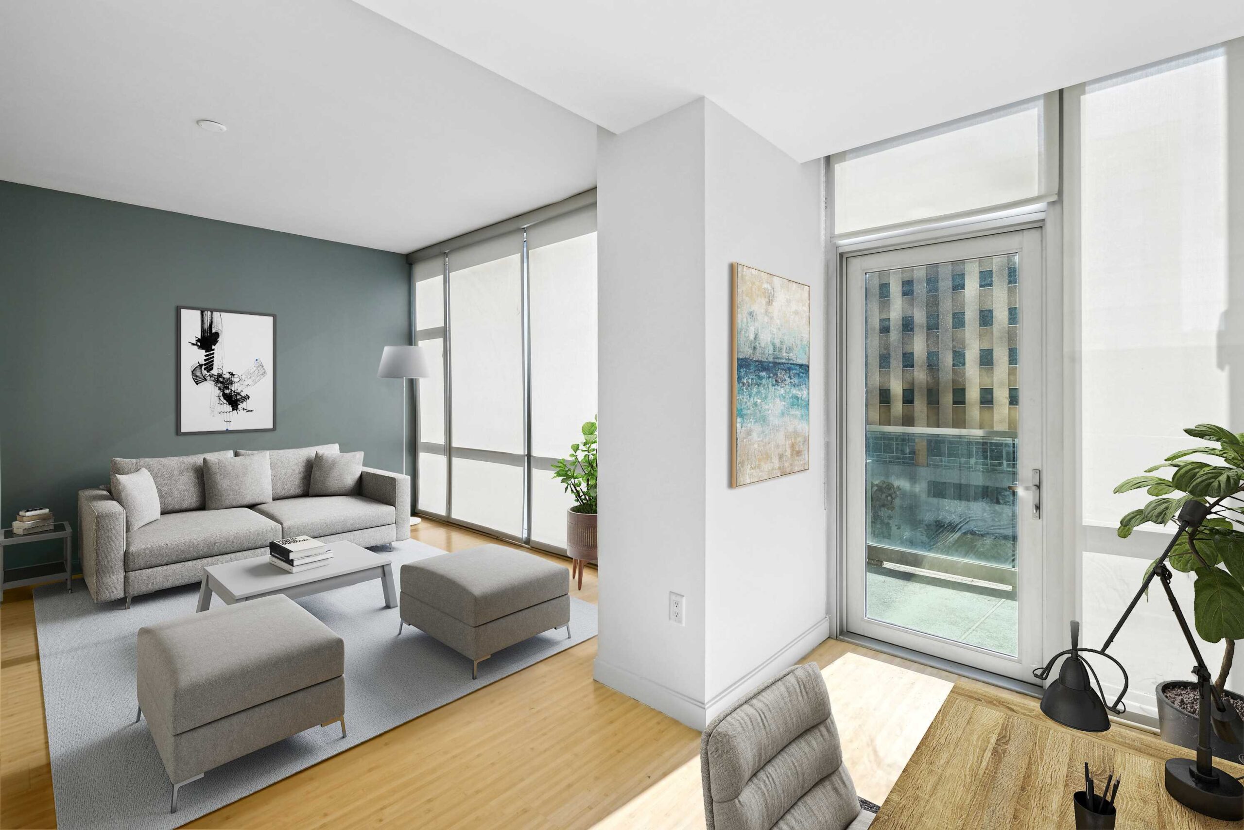 Living room with large window walls and modern furniture in The Element luxury apartment in Dallas Texas