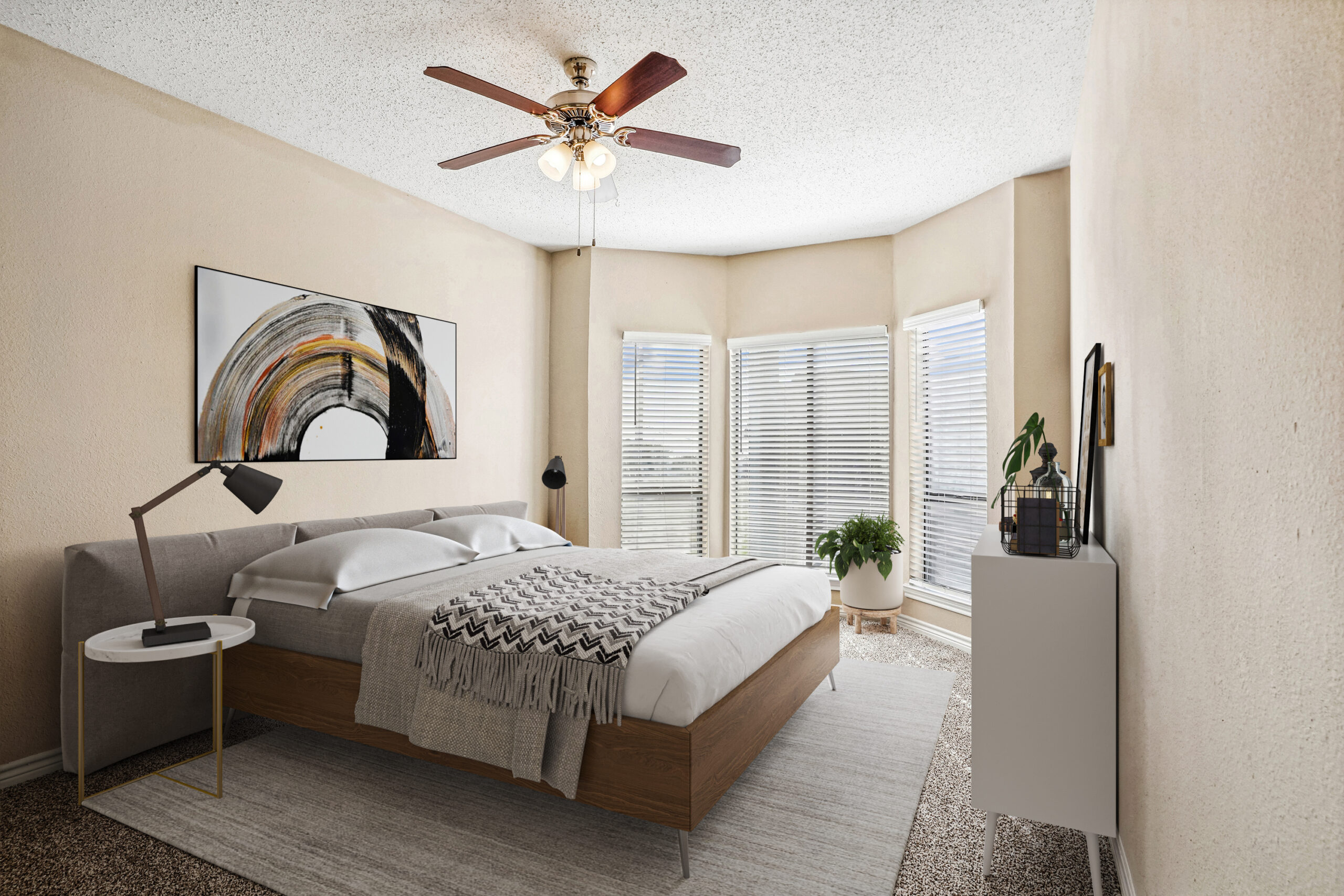 Spacious, bedroom in a Garland Texas apartment, featuring soft carpeting, natural light, and a ceiling fan