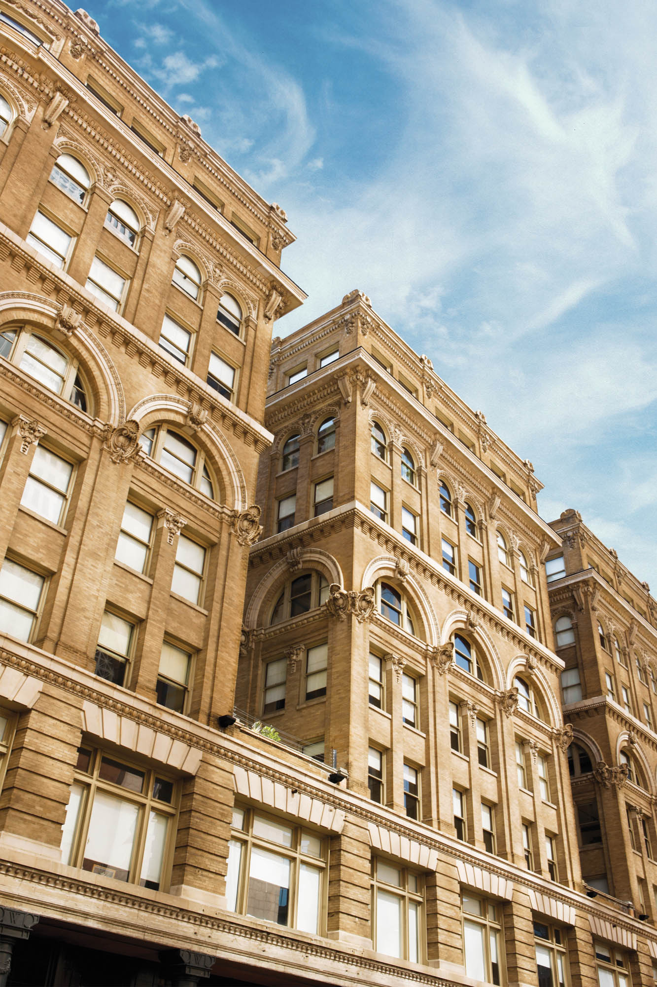 Vertical view of The Wilson apartments in downtown Dallas Texas