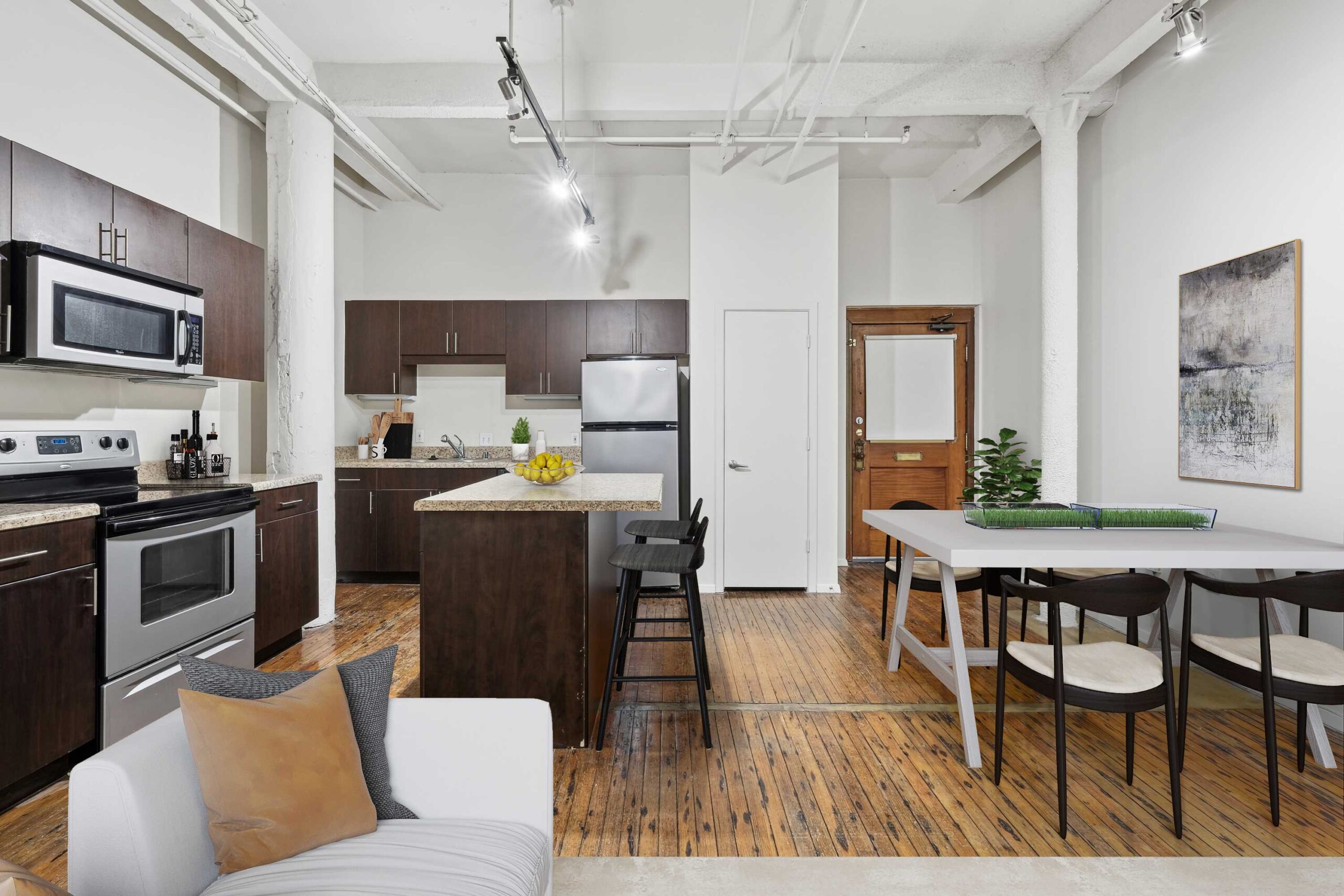 Interior apartment kitchen and dining space at The Wilson apartments in downtown Dallas, Texas