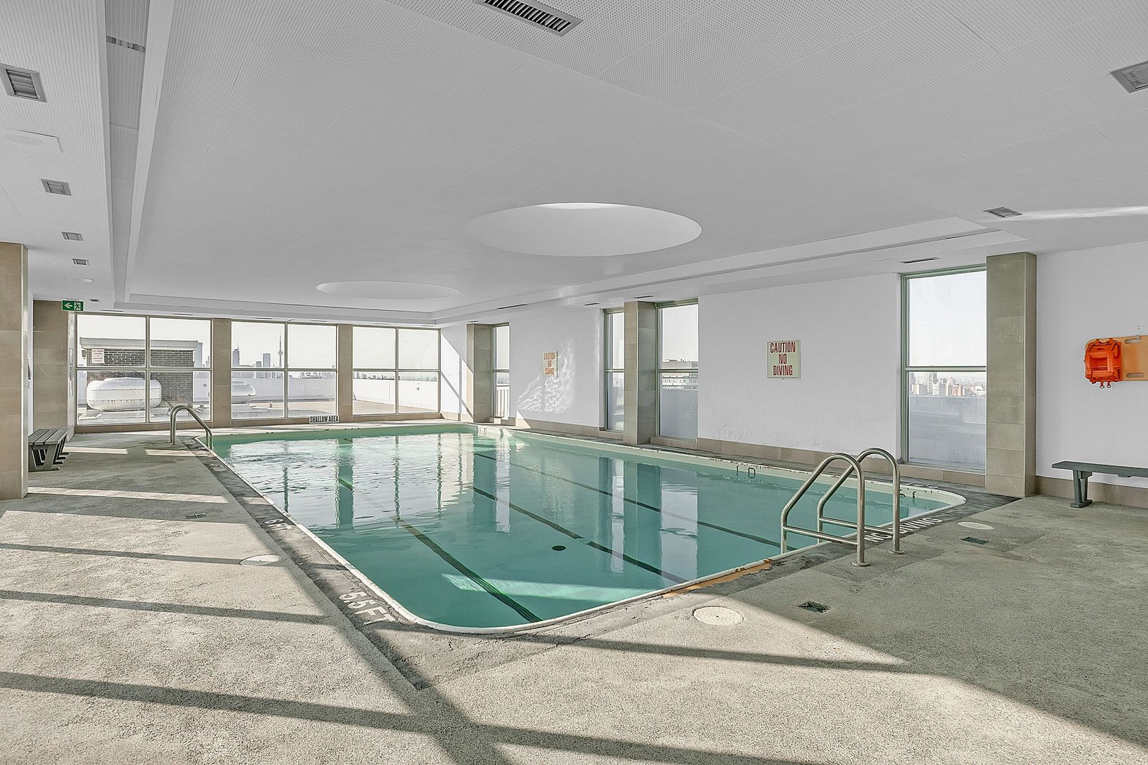 An Indoor rooftop pool with four lanes at the Toronto's 77 Davisville apartments for rent