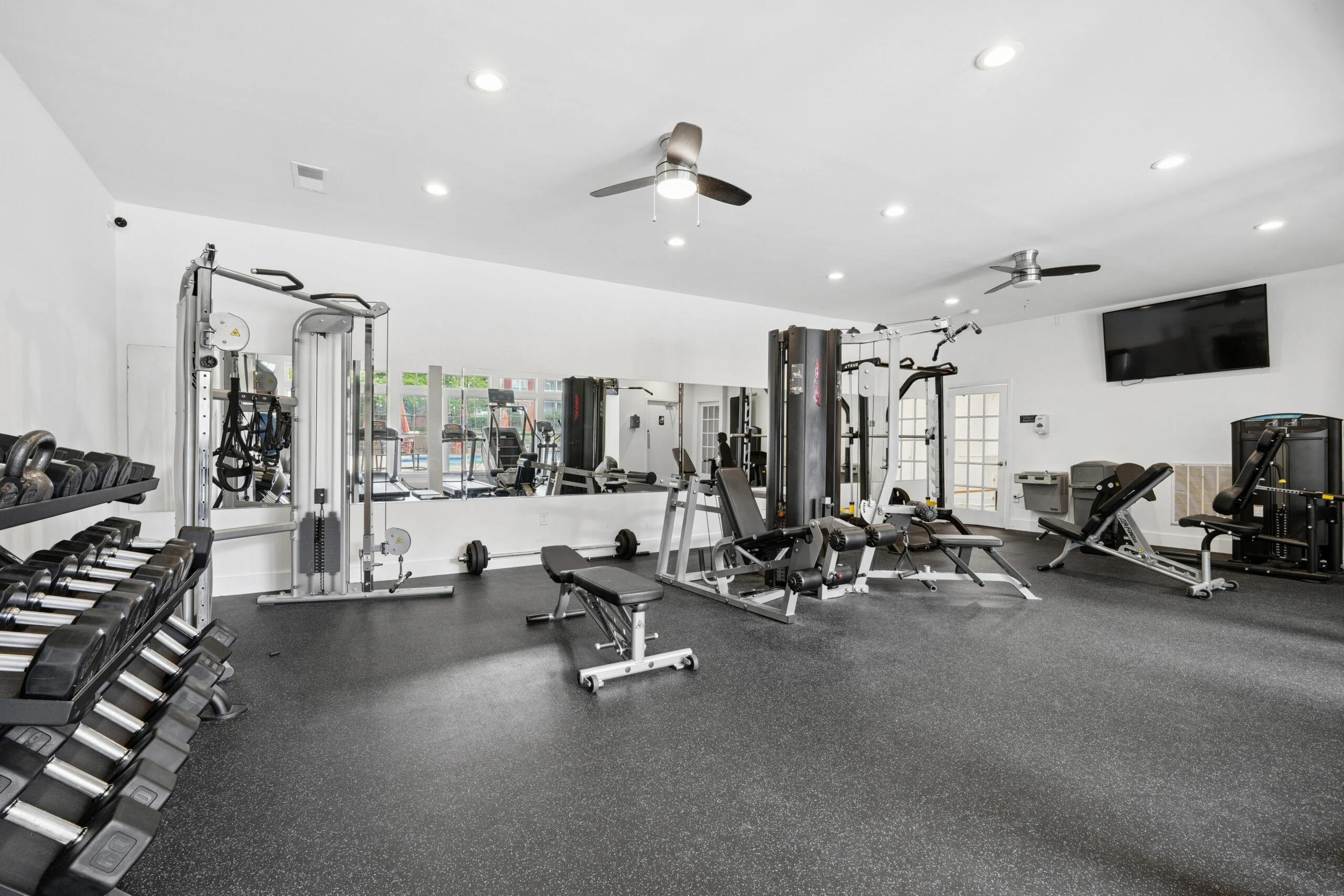 Fully equipped fitness center with free weights and cardio machines