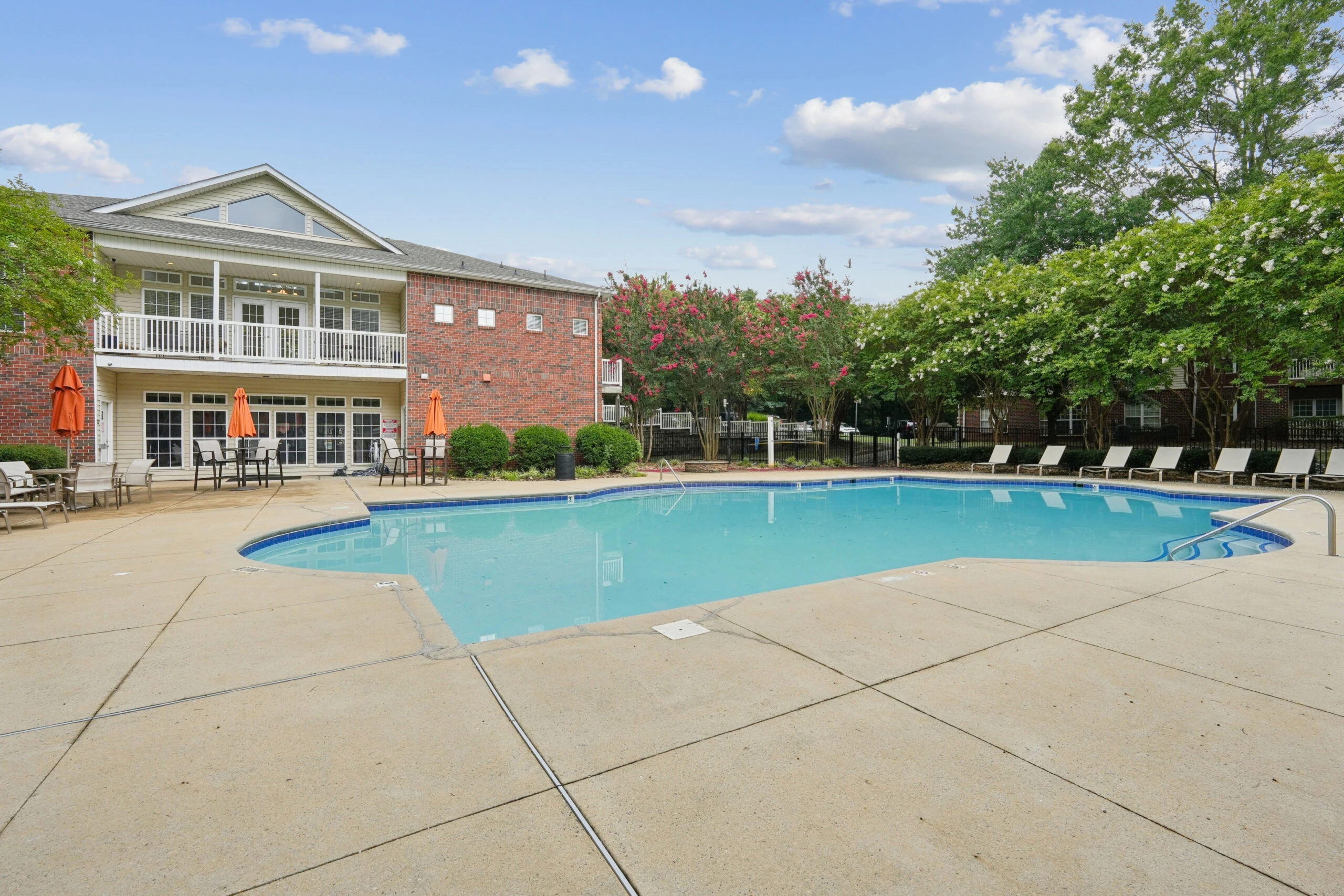 Ashford Place sparkling outdoor pool with lounge seating