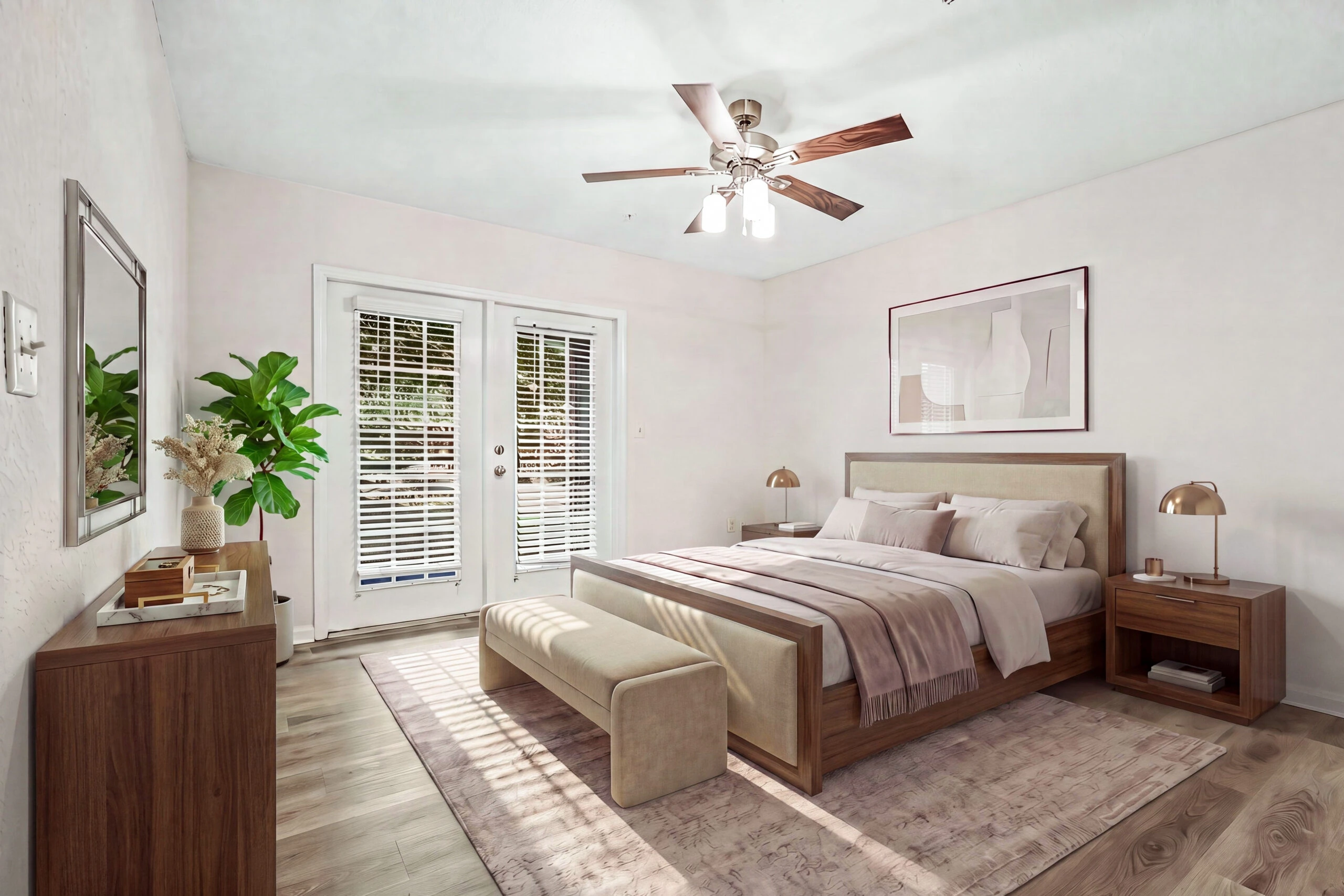 Spacious and bright master bedroom with ceiling fan, plank hardwood flooring, and doors to open out to your personal patio.